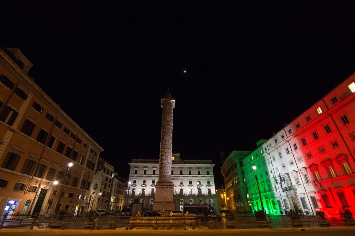 View of Palazzo Chigi illuminated with the colors of the Italian flag