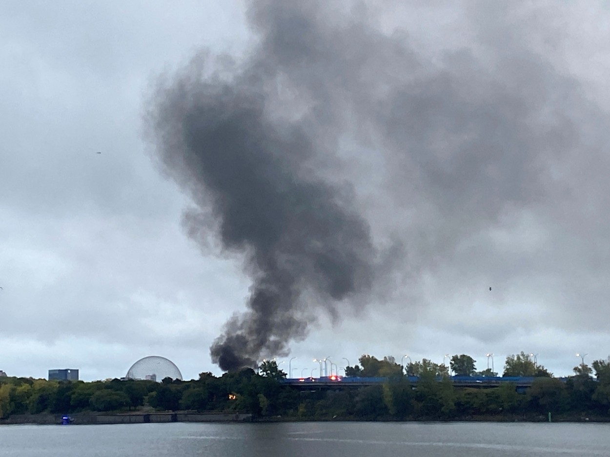 Smoke and fire are shown in Montreal on Saturday Oct. 2, 2021. Montreal police say an investigation is underway after a suspected plane crash on an island near Old Montreal. There was no immediate word on injuries or damage caused by the crash in the Ãle Sainte-HÃ©lÃ¨ne area of the city.,Image: 636103574, License: Rights-managed, Restrictions: World rights excluding North America, Model Release: no, Credit line: Profimedia