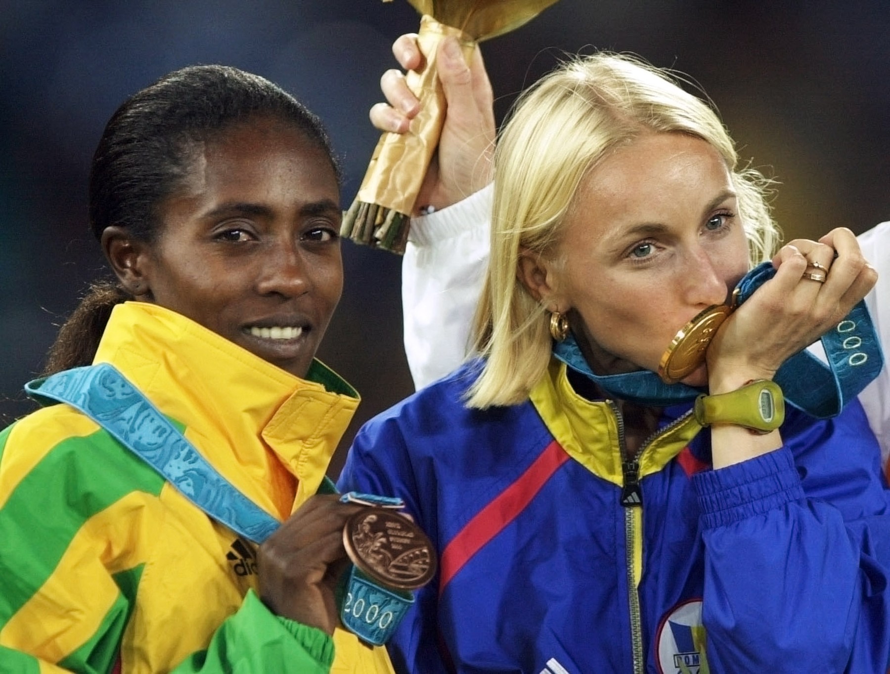 Romanian gold medalist Gabriela Szabo (R) and Ethiopian bronze medalist Gete Wami pose on the podium of the Olympic 5,000m competition in Sydney 25 September 2000.,Image: 68972464, License: Rights-managed, Restrictions: , Model Release: no, Credit line: Profimedia