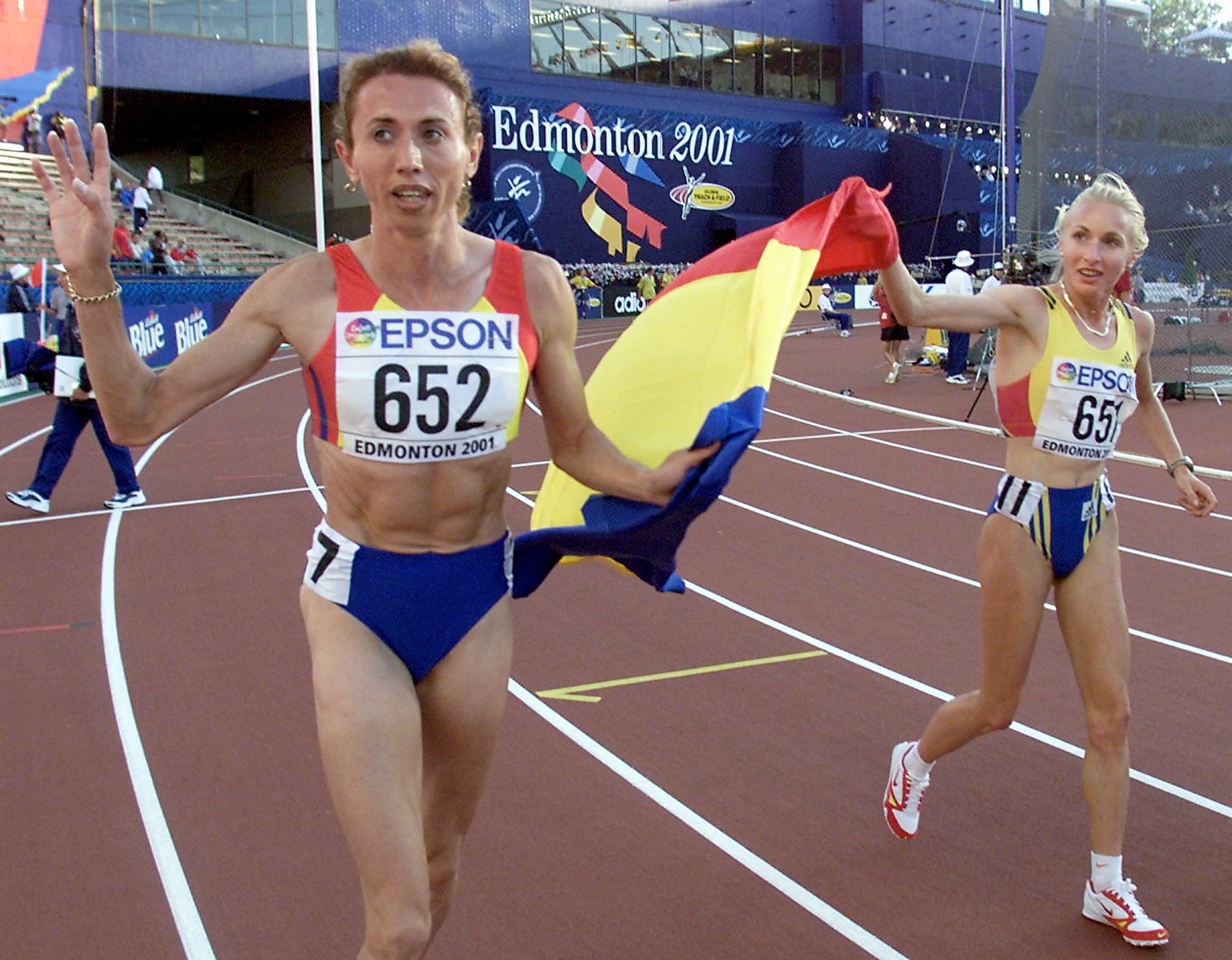 Gabriela Szabo of Romania (R) and compatriot Violeta Szekely celebrate their gold and silver medal wins in the women's 1500M final at the 8th World Championships in Athletics 07 August, 2001, in Commonwealth Stadium in Edmonton Canada. Szabo took the gold in 4:00.57 and Szekely wonthe silver in 4:01.70.,Image: 69151372, License: Rights-managed, Restrictions: , Model Release: no, Credit line: Profimedia