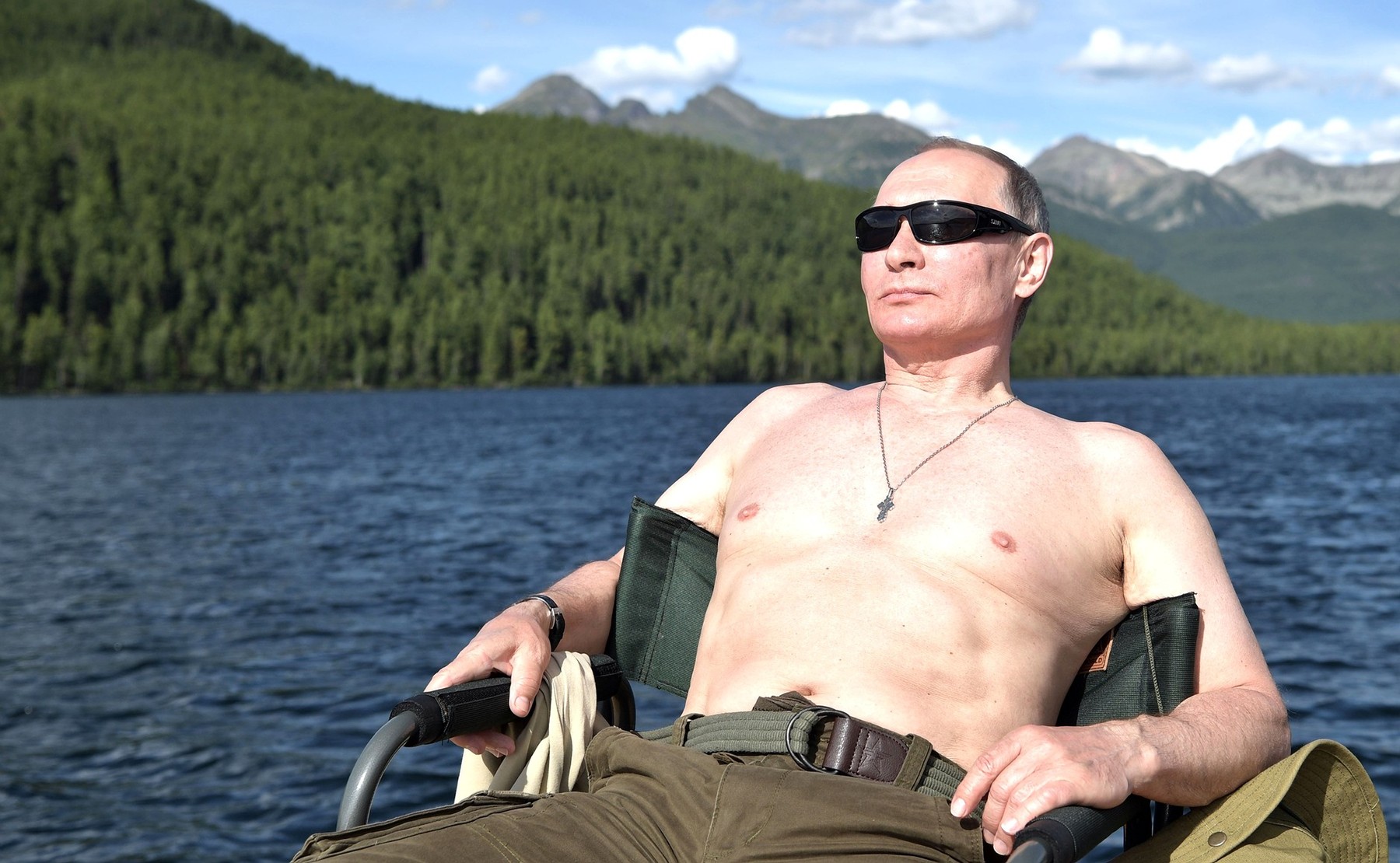 August 3, 2017 - Tyva, Tyva, Russia - Russian President Vladimir Putin relaxes in the sun shirtless after fishing during a three-day fishing and hunting adventure in the Siberian wilderness near the Mongolian border August 1-3, 2017 in the Tyva Republic, Russia.,Image: 344546406, License: Rights-managed, Restrictions: , Model Release: no, Credit line: Profimedia