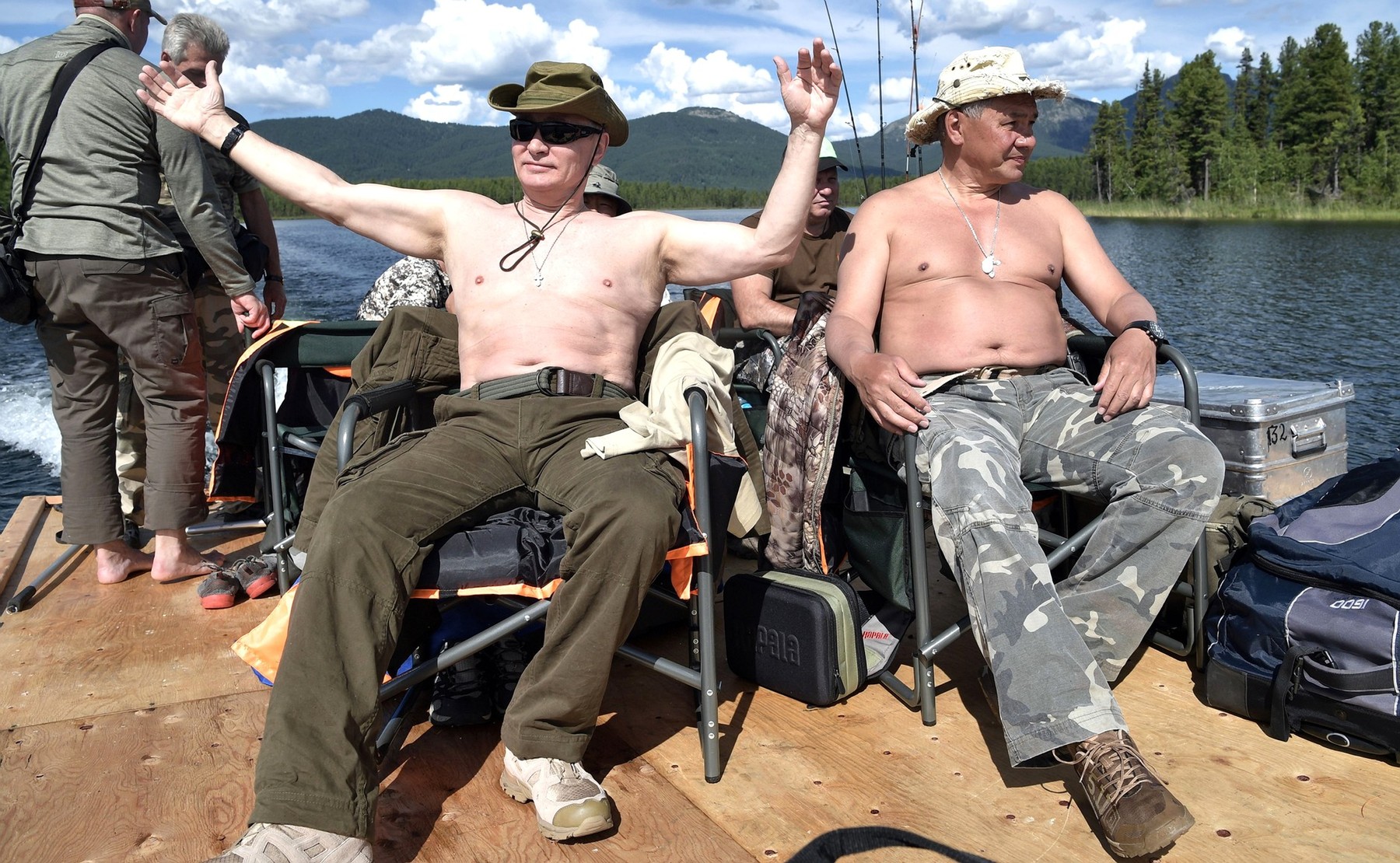 August 3, 2017 - Tyva, Tyva, Russia - Russian President Vladimir Putin, left, and Defense Minister Sergei Shoigu relax in the sun shirtless after fishing during a three-day fishing and hunting adventure in the Siberian wilderness near the Mongolian border August 1-3, 2017 in the Tyva Republic, Russia.,Image: 344547065, License: Rights-managed, Restrictions: , Model Release: no, Credit line: Profimedia