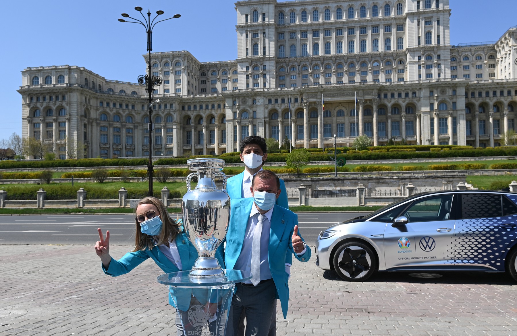 Former Romanian athlete Gabriela Szabo (L), former Romanian football player Miodrag Belodedici (C) and former Romanian football player Dorinel Munteanu (R) pose in front of the Parliament palace next to the Henri Delaunay trophy of the UEFA Euro 2020 football competition during its presentation tour in Bucharest, April 25, 2021. Held over from 2020 due to the pandemic, the European Championship will now be held in 11 different countries from June 11-July 11, 2021.,Image: 607812874, License: Rights-managed, Restrictions: , Model Release: no, Credit line: Profimedia