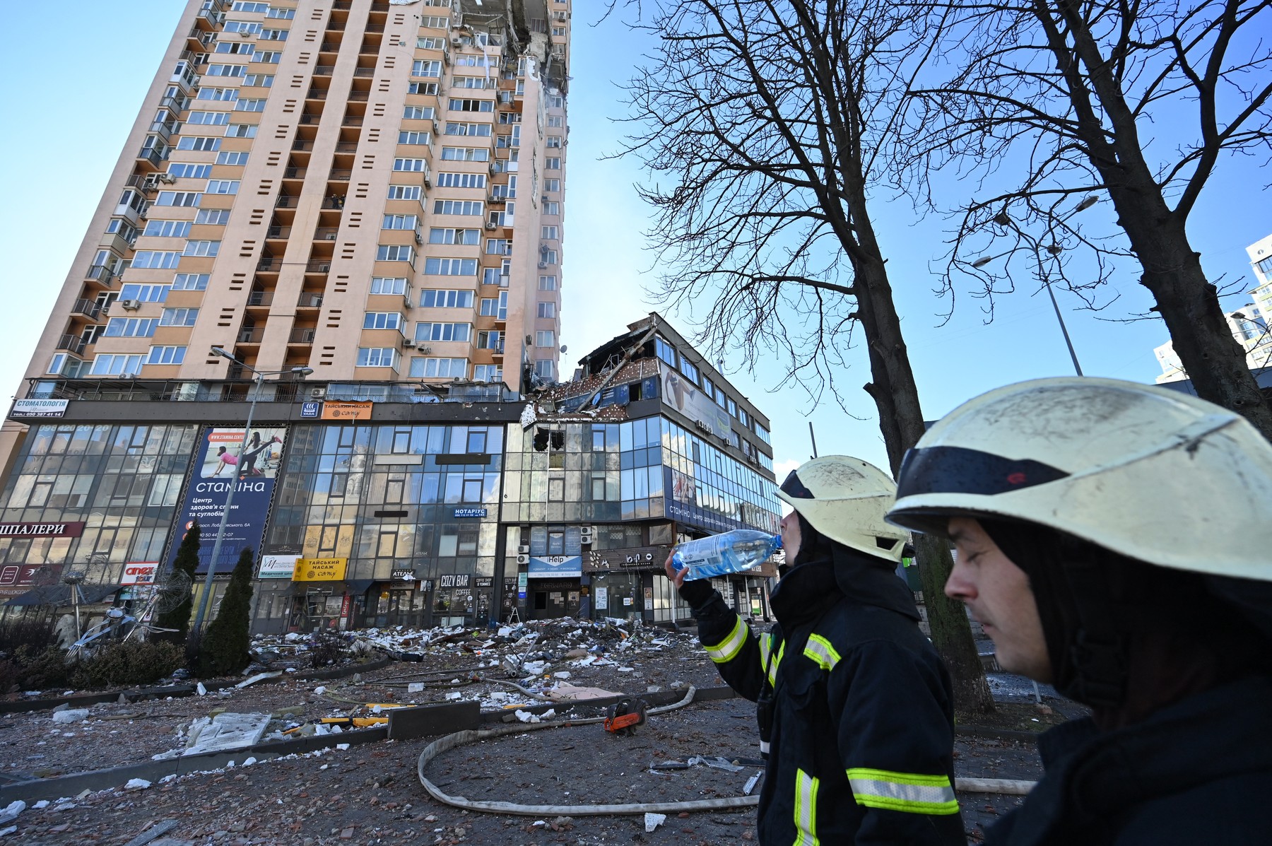 Firefighters work by a high-rise apartment block which was hit by recent shelling in Kyiv on February 26, 2022. Ukrainian soldiers repulsed a Russian attack in the capital, the military said on February 26 after a defiant President Volodymyr Zelensky vowed his pro-Western country would not be bowed by Moscow. It started the third day since Russian leader Vladimir Putin unleashed a full-scale invasion that has killed dozens of people, forced more than 50,000 to flee Ukraine in just 48 hours and sparked fears of a wider conflict in Europe.,Image: 665052431, License: Rights-managed, Restrictions: , Model Release: no, Credit line: Profimedia