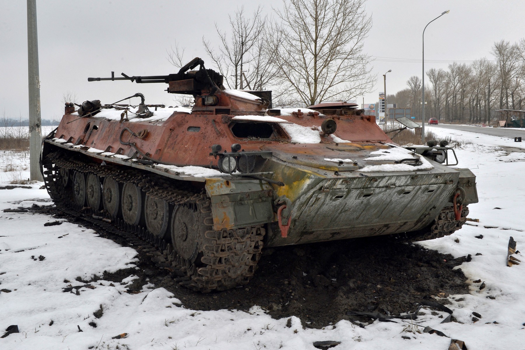 A destroyed Russian military vehicle is seen on the roadside on the outskirts of Kharkiv on February 26, 2022, following the Russian invasion of Ukraine. Ukrainian forces repulsed a Russian attack on Kyiv but 