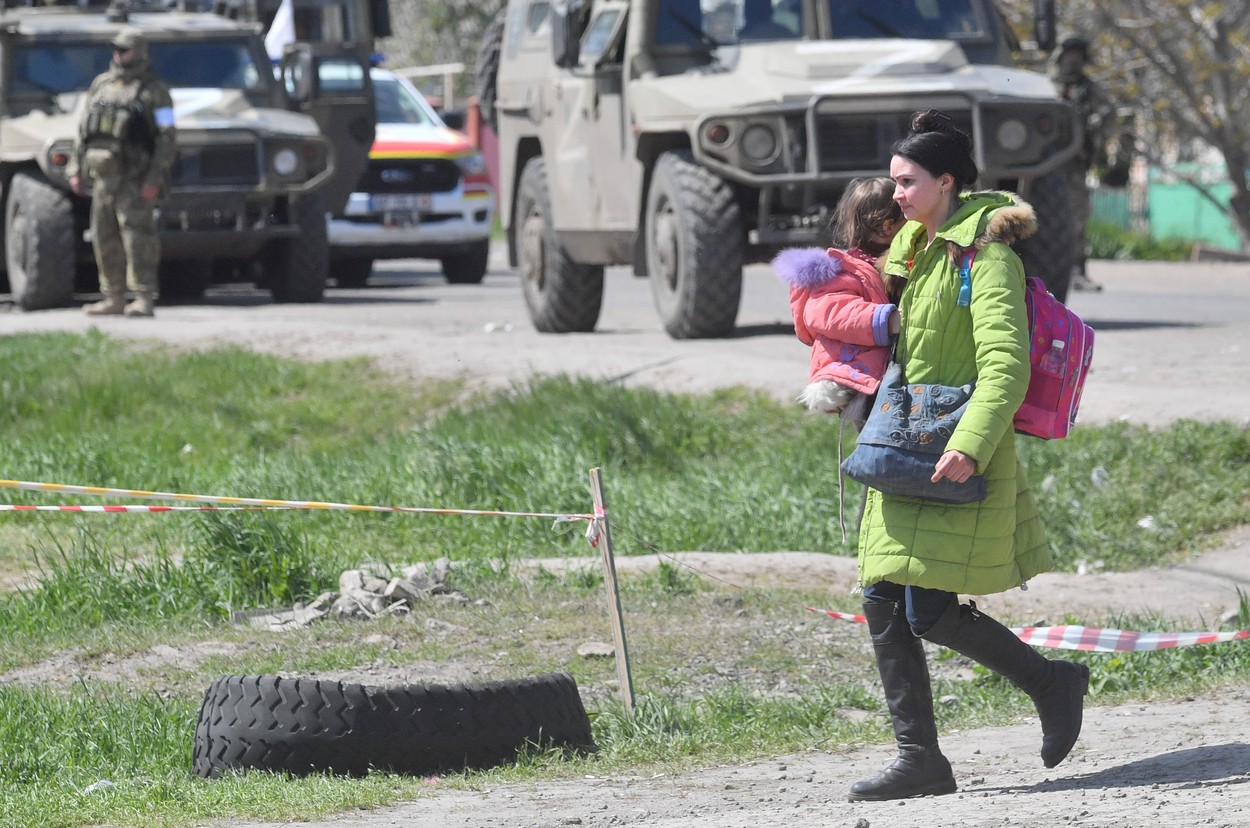 8181019 01.05.2022 A woman holds a child in an aid post for evacuees from Mariupol, who lives close to the plant of Azovstal Iron and Steel Works, in Bezymennoe village, Donetsk People's Republic. In the aid people get accommodation, food and medical help.,Image: 687692666, License: Rights-managed, Restrictions: Editors' note: THIS IMAGE IS PROVIDED BY RUSSIAN STATE-OWNED AGENCY SPUTNIK., Model Release: no, Credit line: Profimedia