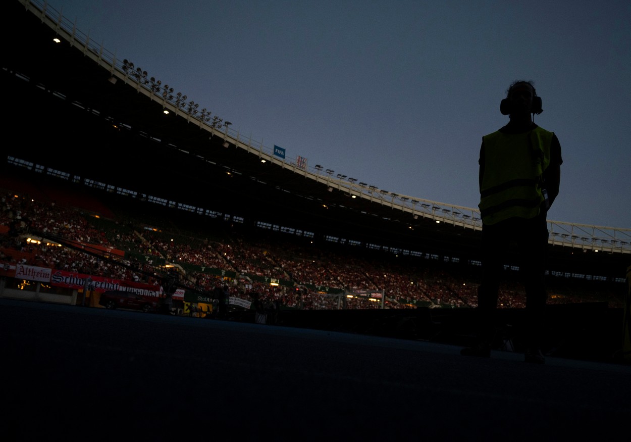 A technician stands in the dark during a electricty black out causing a delay to the kick-off of the UEFA Nations League the UEFA Nations League football match Austria v Denmark in Vienna, Austria on June 6, 2022.,Image: 697484065, License: Rights-managed, Restrictions: , Model Release: no, Credit line: Profimedia
