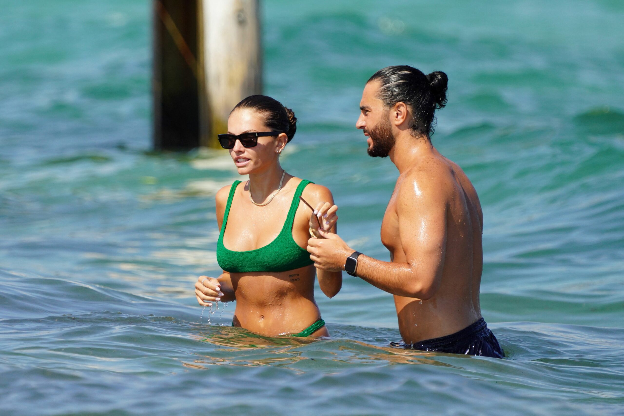 'Most beautiful girl in the world’ Thylane Blondeau showcases her stunning natural beauty in a green bikini as she soaked up the sun with her actor boyfriend Ben Attal in St Tropez, south of France on Tuesday August 16, 2022. NO CREDIT a3