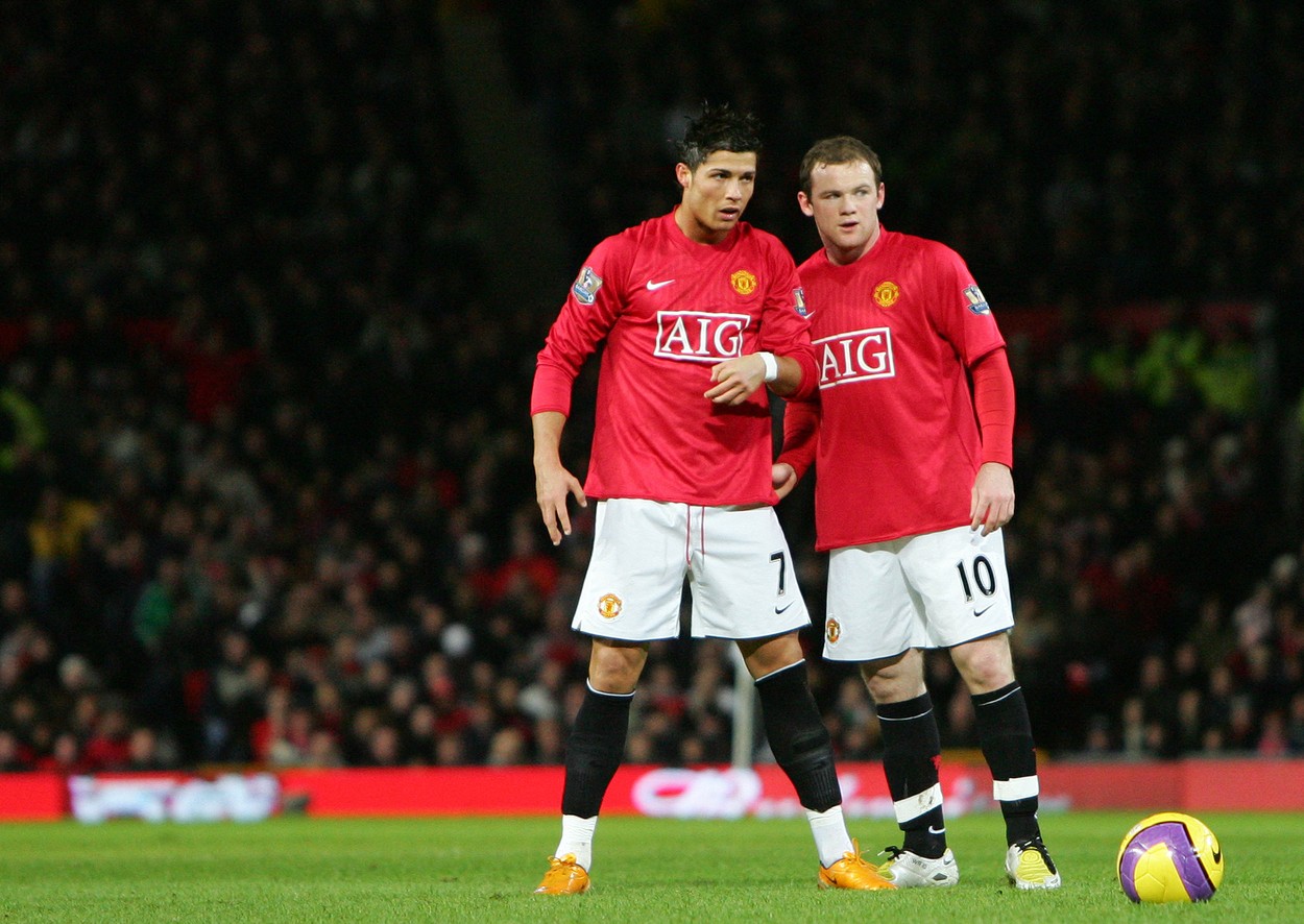 Cristiano Ronaldo și Wayne Rooney, într-un meci disputat de Manchester United