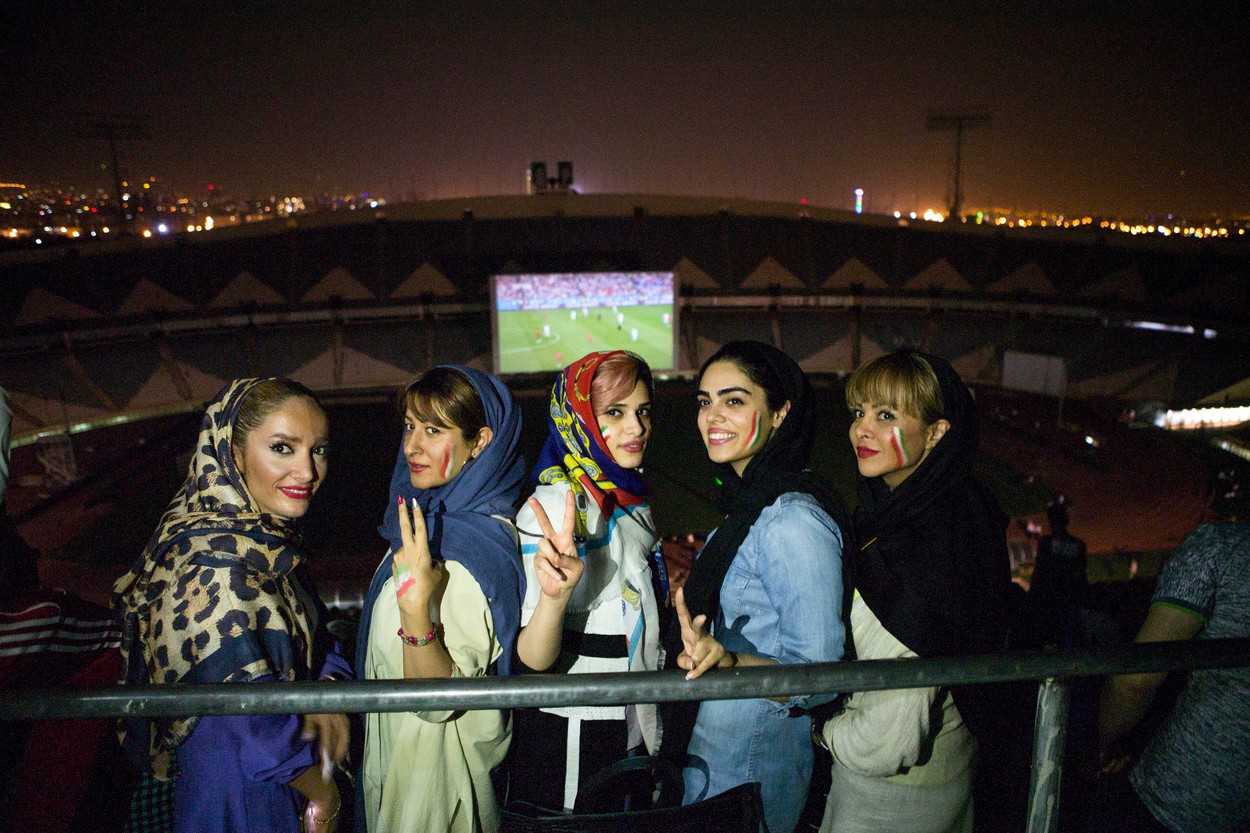 (180627) -- TEHRAN, June 27, 2018  -- Iranian women pose for photo as they watch the 2018 FIFA World Cup football group B match between Iran and Portugal on a giant screen at Azadi Stadium in Tehran, Iran, June 26, 2018.,Image: 376248125, License: Rights-managed, Restrictions: WORLDWIDE RIGHTS AVAILABLE EXCLUDING CHINA, HONG KONG ONLY. End users shall not licence, sell, transmit, or otherwise distribute any photographs represented by eyevine, to any third party. Contact eyevine for more information: Tel: +44 (0) 20 8709 8709 Ema, Model Release: no