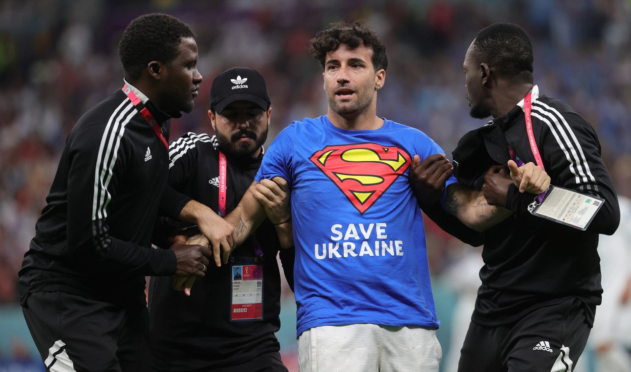 Security members take care of a streaker with a tee-shirt of superman saying save Ukraine during a soccer game between Portugal and Uruguay, in Group H of the FIFA 2022 World Cup in Lusail Stadium, in Lusail, State of Qatar on Monday 28 November 2022.
Soccer World Cup 2022 Portugal Vs Uruguay, Lusail, Qatar - 28 Nov 2022,Image: 740788707, License: Rights-managed, Restrictions: , Model Release: no