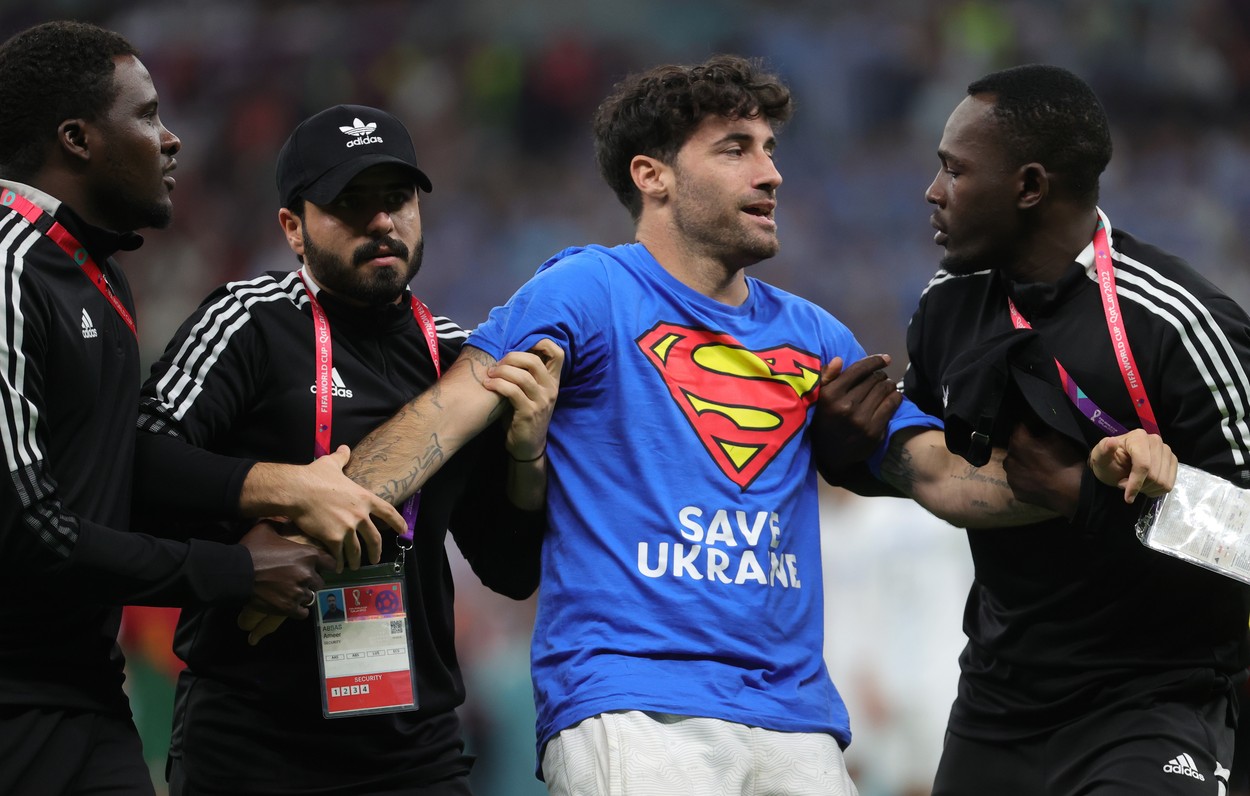 Security members take care of a streaker with a tee-shirt of superman saying save Ukraine during a soccer game between Portugal and Uruguay, in Group H of the FIFA 2022 World Cup in Lusail Stadium, in Lusail, State of Qatar on Monday 28 November 2022.
Soccer World Cup 2022 Portugal Vs Uruguay, Lusail, Qatar - 28 Nov 2022,Image: 740788716, License: Rights-managed, Restrictions: , Model Release: no