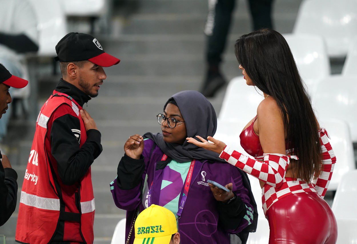 Croatia fan and model Ivana Knoll (right) speaks with security in the stands ahead of the FIFA World Cup Quarter-Final match at the Education City Stadium in Al Rayyan, Qatar. Picture date: Friday December 9, 2022.,Image: 743521462, License: Rights-managed, Restrictions: Use subject to restrictions. Editorial use only, no commercial use without prior consent from rights holder., Model Release: no