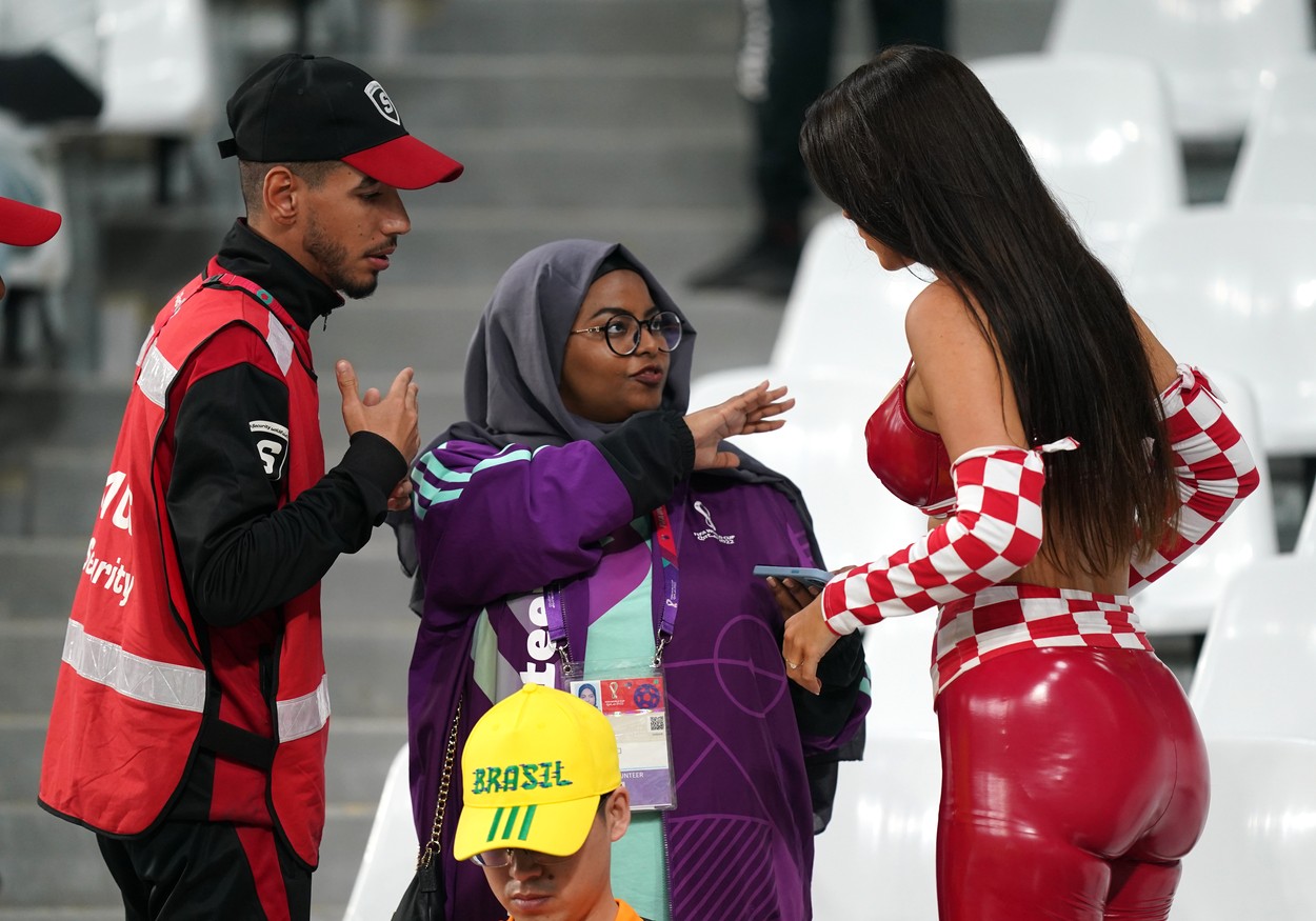 Croatia fan and model Ivana Knoll (right) speaks with security in the stands ahead of the FIFA World Cup Quarter-Final match at the Education City Stadium in Al Rayyan, Qatar. Picture date: Friday December 9, 2022.,Image: 743521665, License: Rights-managed, Restrictions: Use subject to restrictions. Editorial use only, no commercial use without prior consent from rights holder., Model Release: no