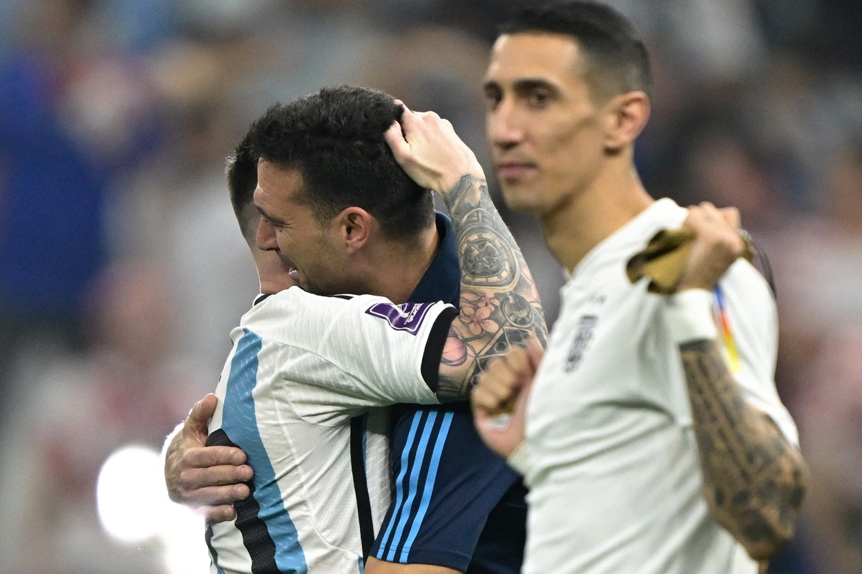Argentina's forward #10 Lionel Messi and Argentina's coach Lionel Scaloni celebrate near Argentina's midfielder #11 Angel Di Maria after defeating Croatia 3-0 in the Qatar 2022 World Cup football semi-final match between Argentina and Croatia at Lusail Stadium in Lusail, north of Doha on December 13, 2022.,Image: 744421116, License: Rights-managed, Restrictions: , Model Release: no