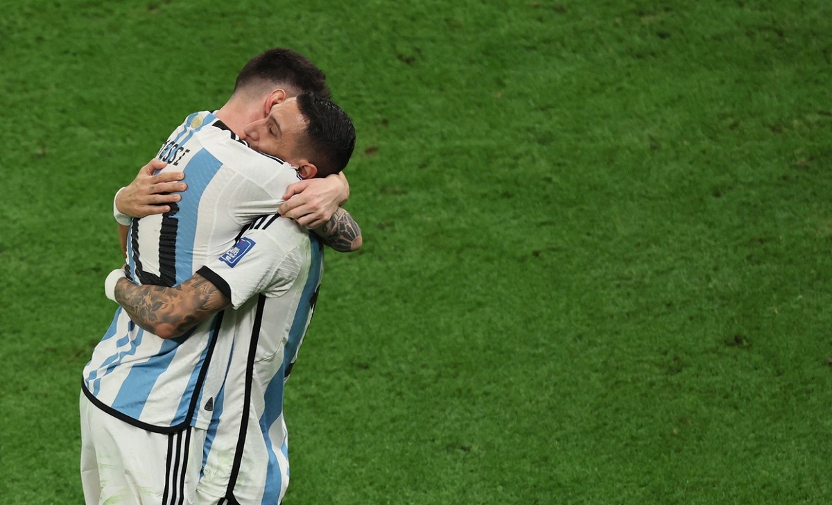 Argentina's forward #10 Lionel Messi celebrates with Argentina's midfielder #11 Angel Di Maria after scoring his team's first goal during the Qatar 2022 World Cup final football match between Argentina and France at Lusail Stadium in Lusail, north of Doha on December 18, 2022.,Image: 745369540, License: Rights-managed, Restrictions: , Model Release: no