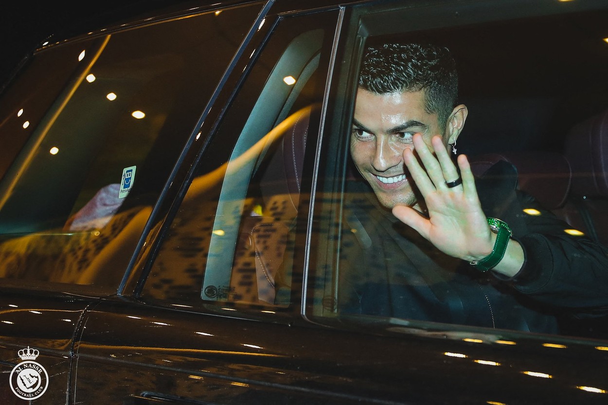 A handout photo provided by Saudi soccer club Al Nasr FC on January 2, 2023 shows Portuguese soccer star Cristiano Ronaldo waving upon his arrival to a private airport in Riyadh ahead of being  presented as an Al Nassr player. Ronaldo arrived in Riyadh ahead of his grand unveiling before thousands of fans at Saudi Arabia's Al Nassr club on Tuesday, after sealing a shock move estimated at more than 200 million euros.,Image: 747381326, License: Rights-managed, Restrictions: RESTRICTED TO EDITORIAL USE - MANDATORY CREDIT 