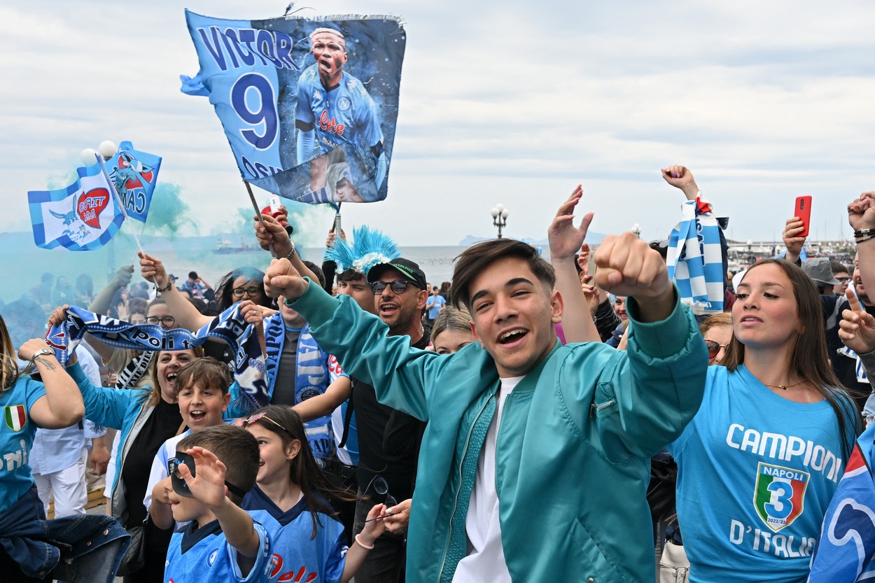 Napoli fans start to celebrate on the seafront of Naples on April 30, 2023 during the Italian Serie A football match between Napoli and Salernitana, after Napoli opened the scoring.  Naples braces for its potential first championship win in 33 years, anticipating its victory in the Scudetto for the first time since 1990.,Image: 772919775, License: Rights-managed, Restrictions: , Model Release: no