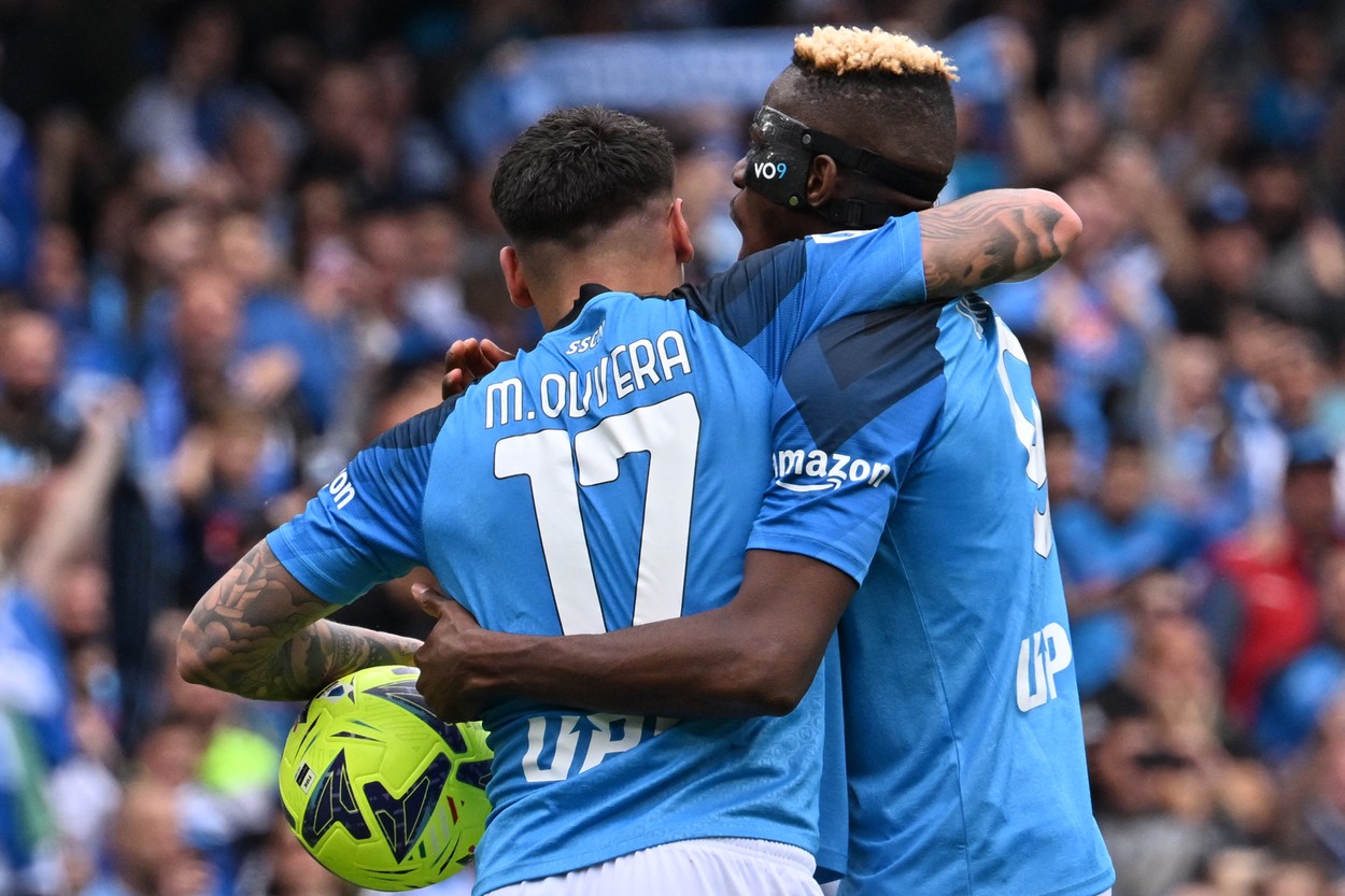 Napoli's Nigerian forward Victor Osimhen (R) congratulates Napoli's Uruguayan defender Mathias Olivera after Olivera opened the scoring during the Italian Serie A football match between Napoli and Salernitana on April 30, 2023 at the Diego-Maradona stadium in Naples.  Naples braces for its potential first Scudetto championship win in 33 years. With a 17 point lead at the top of Serie A, southern Italy's biggest club is anticipating its victory in the Scudetto for the first time since 1990.,Image: 772920901, License: Rights-managed, Restrictions: , Model Release: no