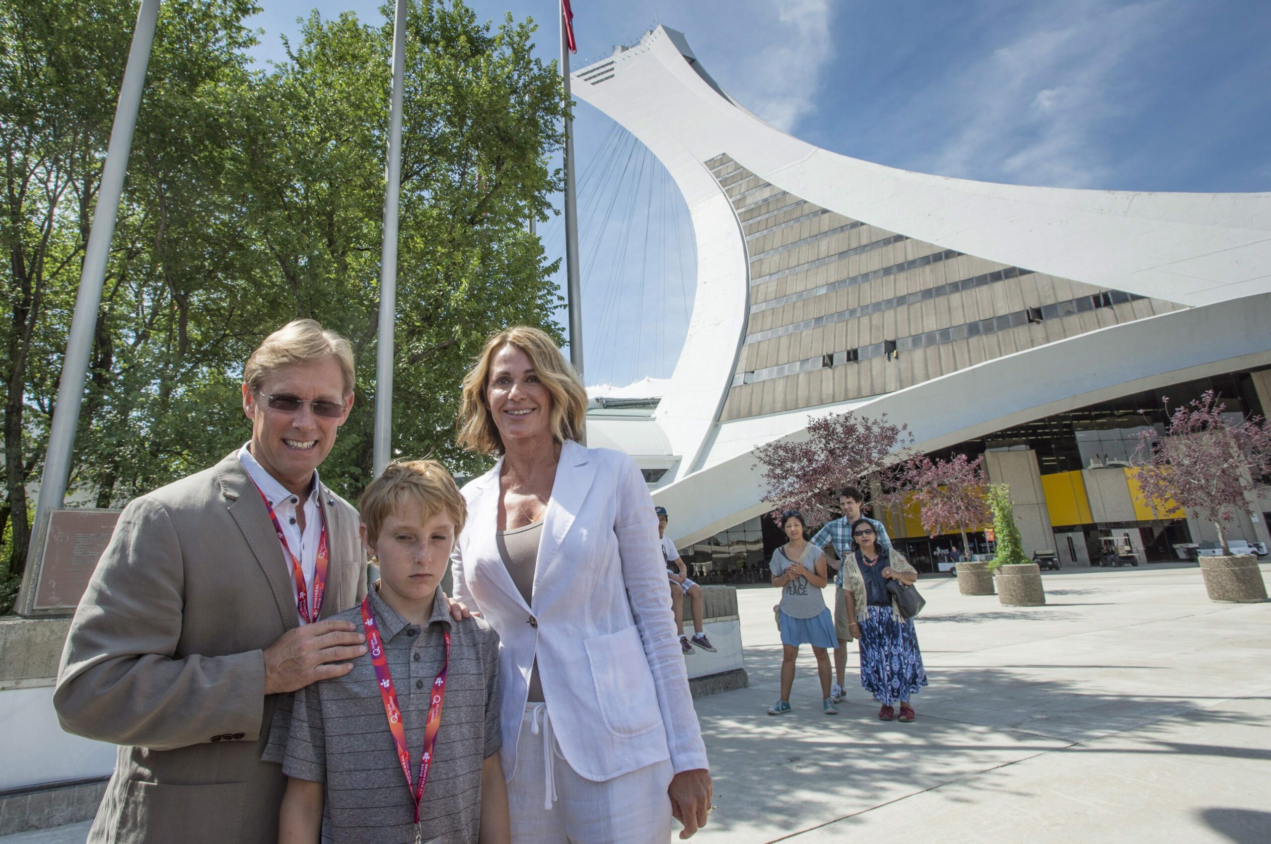 Montreal 1976 Olympics gymnastics champion Nadia Comaneci, her husband Bart Conner and their son Dylan stand next to Olympic Stadium as she tours a exhibit marking the 40th anniversary of the Games Thursday, July 21, 2016 in Montreal. Photo by Paul Chiasson/The Canadian Press/ ABACAPRESS.COM