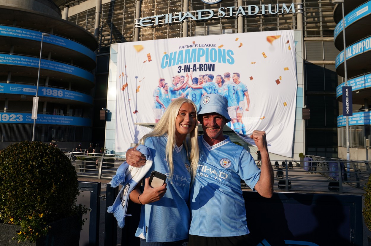 Manchester City fans celebrate outside of the Etihad Stadium after winning the Premier League following the outcome of the Nottingham Forest v Arsenal match. Picture date: Saturday May 20, 2023.,Image: 777734471, License: Rights-managed, Restrictions: , Model Release: no