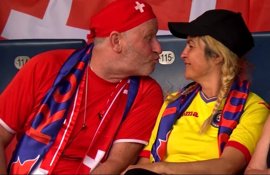 Imaginea serii la Elveţia – România! Un bărbat cu tricoul Elveţiei a sărutat o femeie cu tricoul României