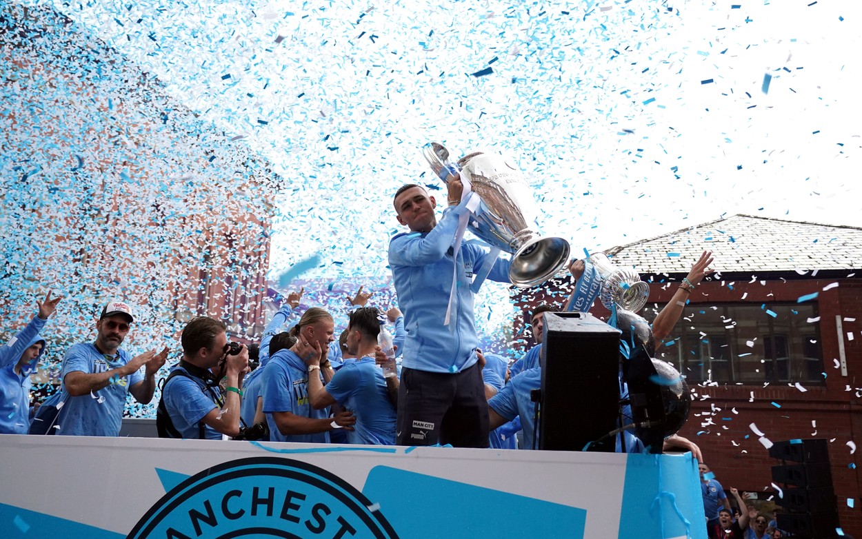 Manchester City's Phil Foden with the UEFA Champions League trophy during the Treble Parade in Manchester. Manchester City completed the treble (Champions League, Premier League and FA Cup) after a 1-0 victory over Inter Milan in Istanbul secured them Champions League glory. Picture date: Monday June 12, 2023.,Image: 782975794, License: Rights-managed, Restrictions: Use subject to restrictions. Editorial use only, no commercial use without prior consent from rights holder., Model Release: no