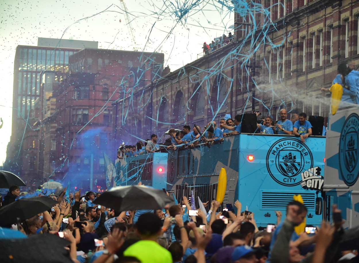 Manchester City Players Brave the rain as they parade through the city centre celebrating there treble win

Pictured:,Image: 782977066, License: Rights-managed, Restrictions: -ALLCOUNTRY, Model Release: no