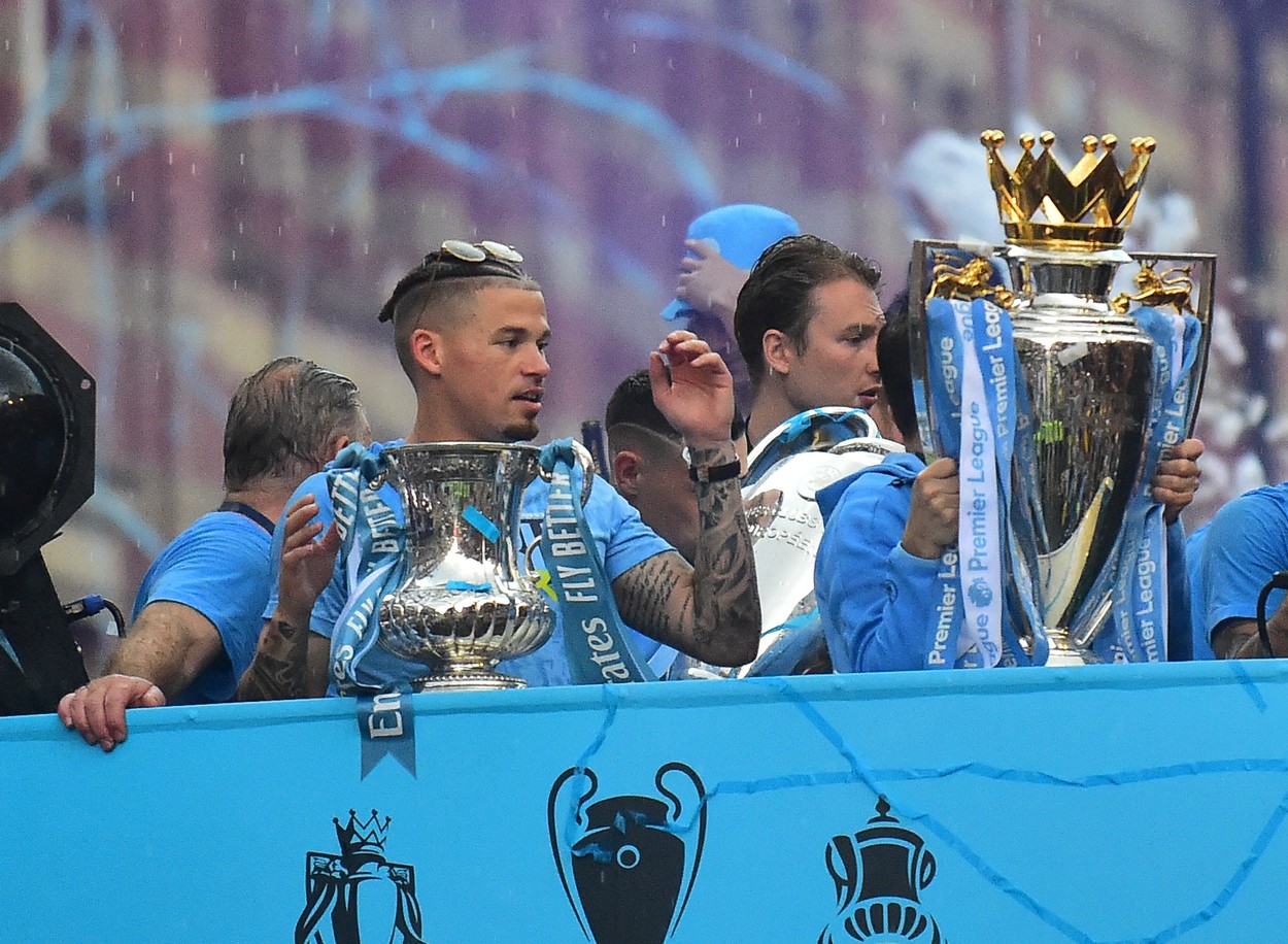 Manchester City Players Brave the rain as they parade through the city centre celebrating there treble win

Pictured:,Image: 782977086, License: Rights-managed, Restrictions: -ALLCOUNTRY, Model Release: no