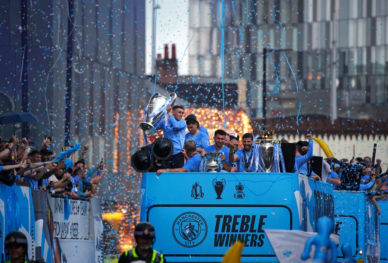 Manchester City's Phil Foden (left) with the Champions League trophy during the Treble Parade in Manchester. Manchester City completed the treble (Champions League, Premier League and FA Cup) after a 1-0 victory over Inter Milan in Istanbul secured them Champions League glory. Picture date: Monday June 12, 2023.,Image: 782977128, License: Rights-managed, Restrictions: Use subject to restrictions. Editorial use only, no commercial use without prior consent from rights holder., Model Release: no
