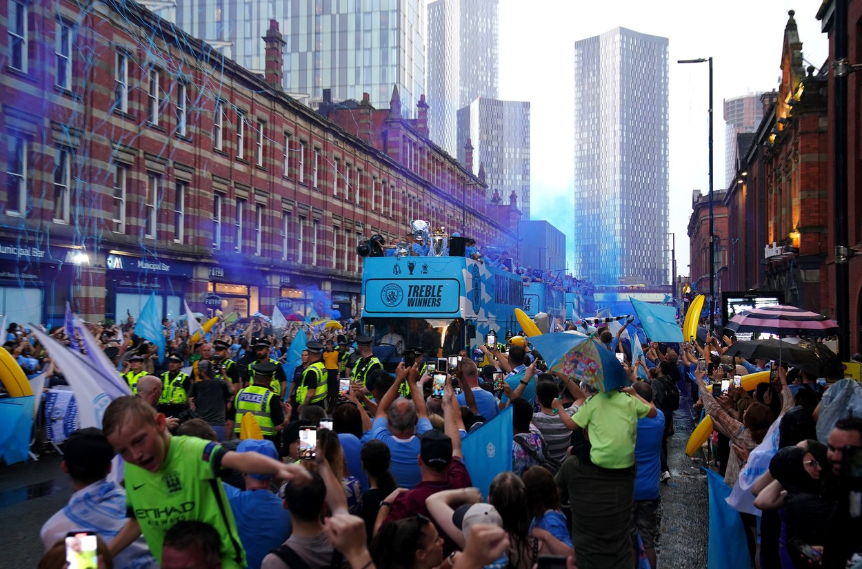 A general view of the bus driving past fans during the Treble Parade in Manchester. Manchester City completed the treble (Champions League, Premier League and FA Cup) after a 1-0 victory over Inter Milan in Istanbul secured them Champions League glory. Picture date: Monday June 12, 2023.,Image: 782977343, License: Rights-managed, Restrictions: Use subject to restrictions. Editorial use only, no commercial use without prior consent from rights holder., Model Release: no