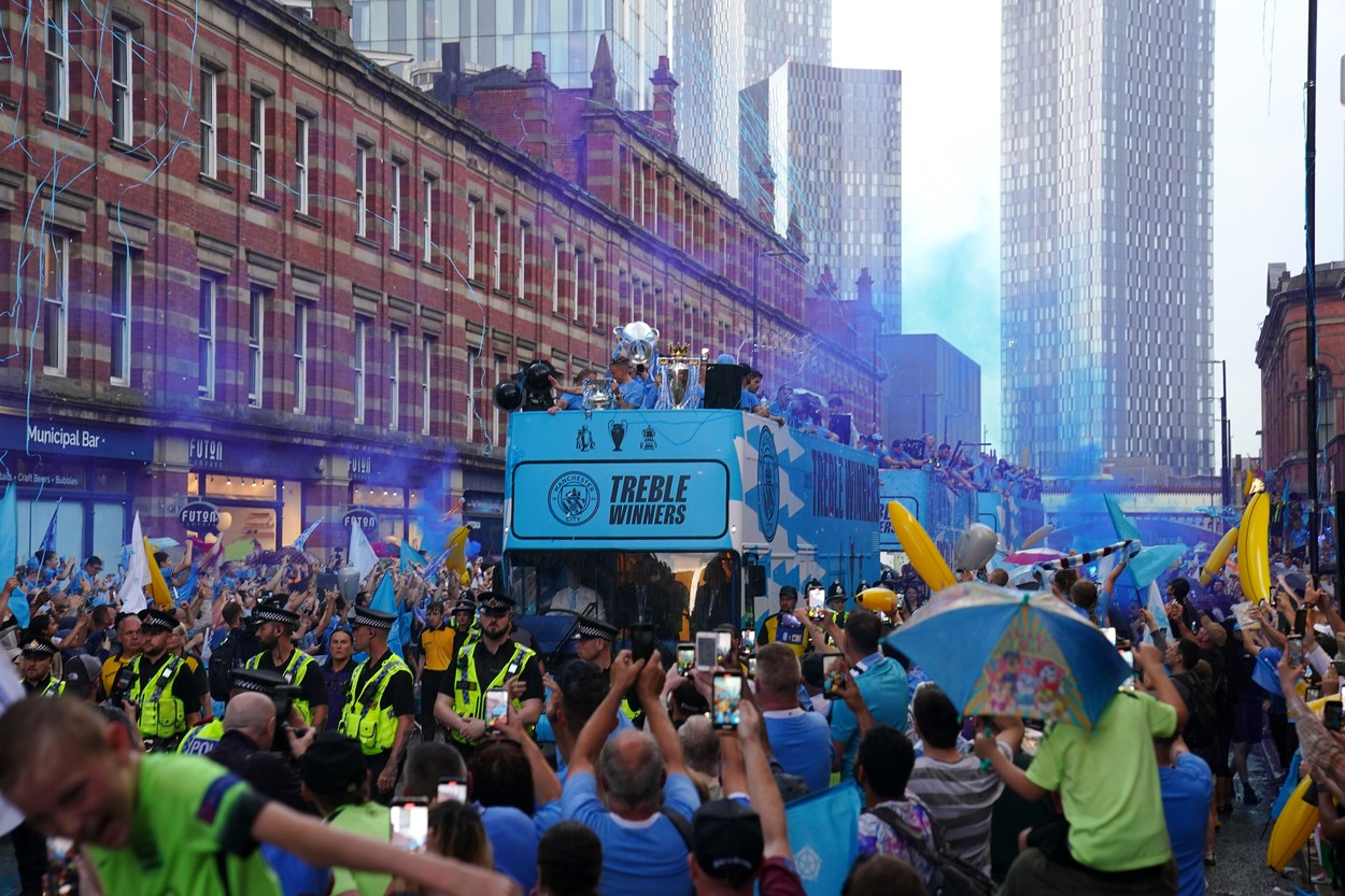 A general view of the bus driving past fans during the Treble Parade in Manchester. Manchester City completed the treble (Champions League, Premier League and FA Cup) after a 1-0 victory over Inter Milan in Istanbul secured them Champions League glory. Picture date: Monday June 12, 2023.,Image: 782977354, License: Rights-managed, Restrictions: Use subject to restrictions. Editorial use only, no commercial use without prior consent from rights holder., Model Release: no