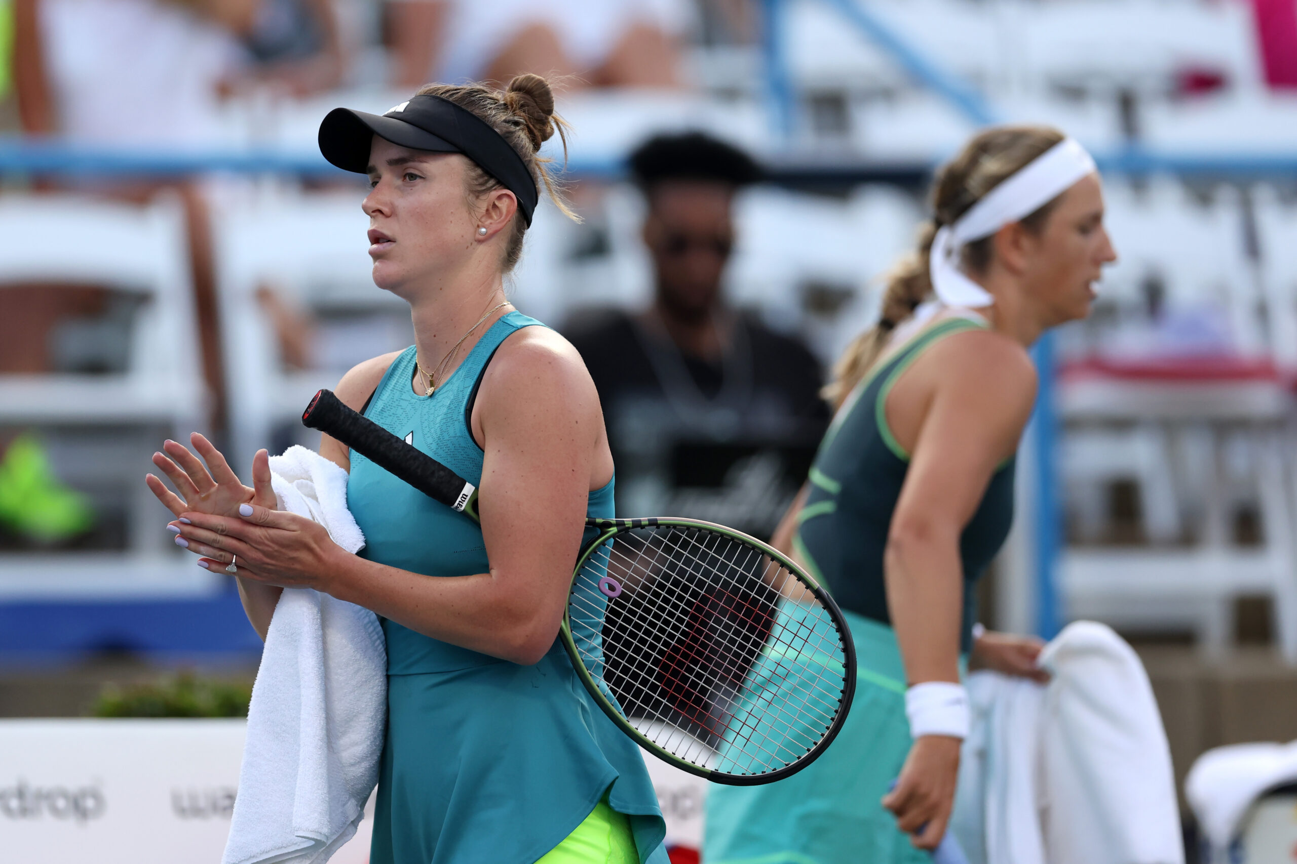 WASHINGTON, DC - JULY 31: Elina Svitolina of Ukraine (L) walks past Victoria Azarenka before the start of their match during Day 3 of the Mubadala Citi DC Open at Rock Creek Tennis Center on July 31, 2023 in Washington, DC. (Photo by Rob Carr/Getty Images)