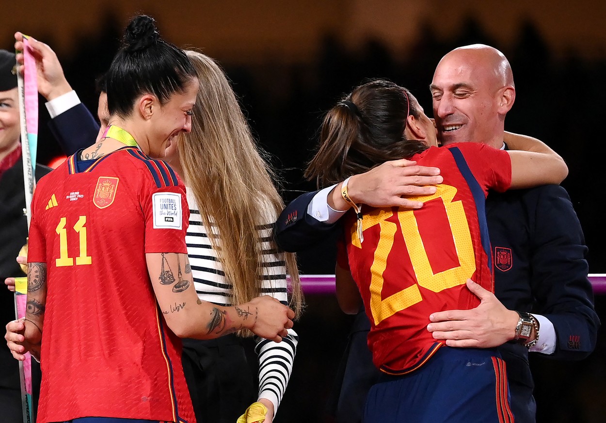 (FILES) Spain's defender #20 Rocio Galvez is congratuled by President of the Royal Spanish Football Federation Luis Rubiales (R) next to Spain's Jennifer Hermoso after winning the Australia and New Zealand 2023 Women's World Cup final football match between Spain and England at Stadium Australia in Sydney on August 20, 2023.,Image: 799223056, License: Rights-managed, Restrictions: TO GO WITH AFP STORY by Marie GIFFARD, Model Release: no