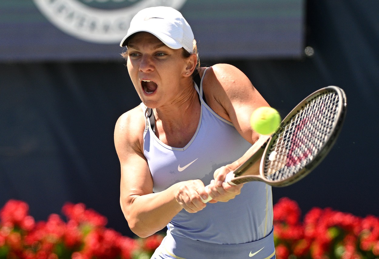 Aug 11, 2022; North York, ON, Canada;  Simona Halep (ROU) plays a shot against Jil Teichmann (SUI) (not pictured) at Sobeys Stadium.,Image: 713428740, License: Rights-managed, Restrictions: *** World Rights ***, Model Release: no