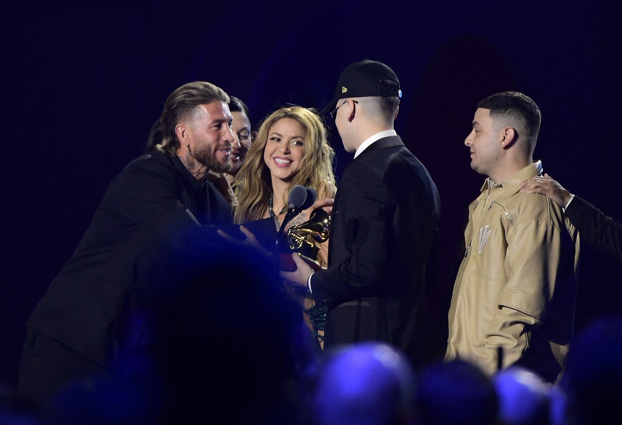 Colombian singer Shakira and Argentinian DJ and record producer Bizarrap (2R) react as they receive their Record of the Year award next to Spanish footballer Sergio Ramos (L) on stage during the 24th Annual Latin Grammy Awards ceremony at the Conference and Exhibition Centre (FIBES) in Sevilla on November 16, 2023. The Annual Latin Grammy Awards ceremony takes place for the first time out of US, gathering the most popular artists of the Latin world at the Conference and Exhibition Centre (FIBES) in Sevilla.,Image: 822526448, License: Rights-managed, Restrictions: , Model Release: no