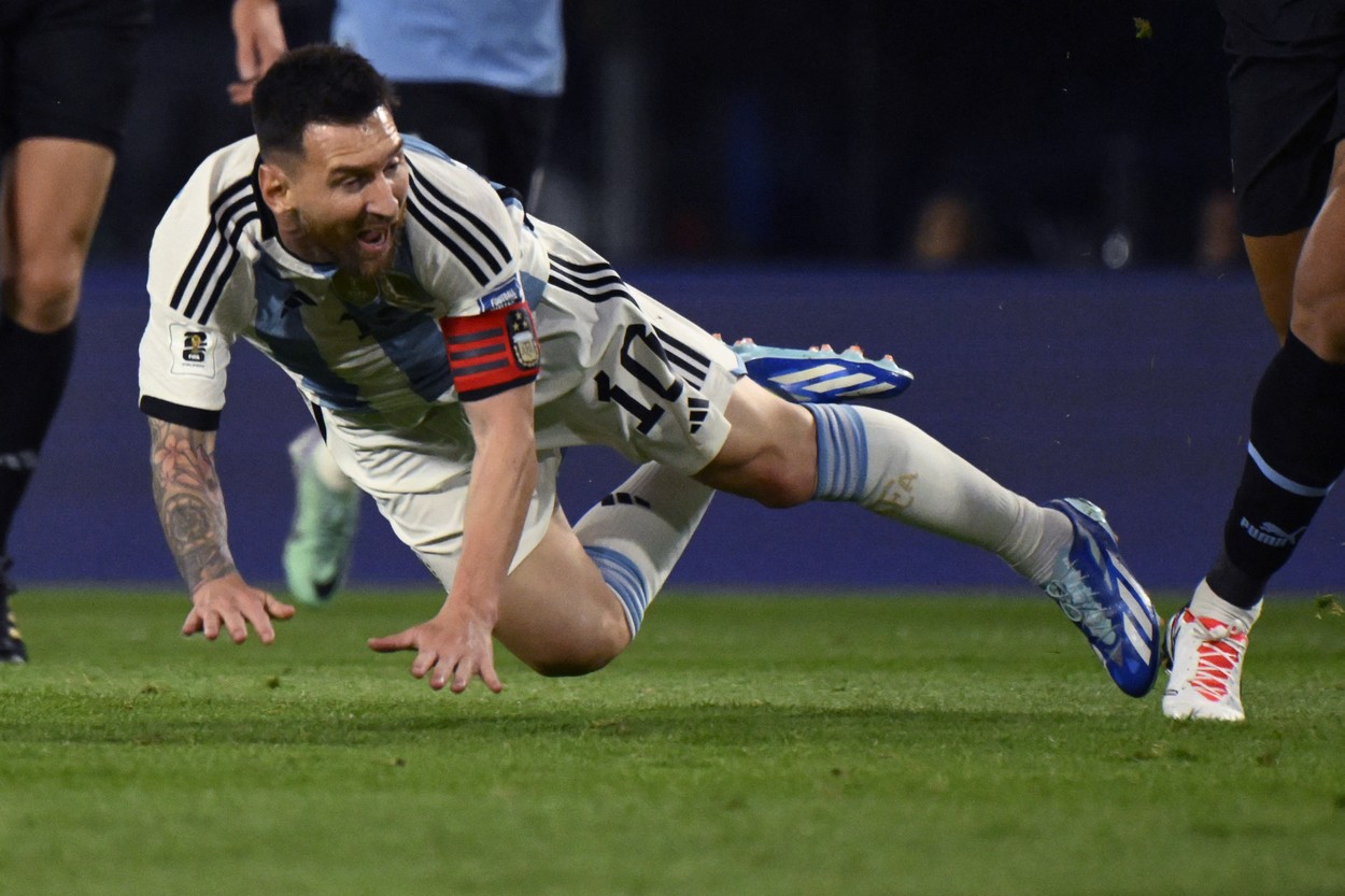 Argentina's forward Lionel Messi falls to the field during the 2026 FIFA World Cup South American qualification football match between Argentina and Uruguay at La Bombonera stadium in Buenos Aires on November 16, 2023.,Image: 822549088, License: Rights-managed, Restrictions: , Model Release: no