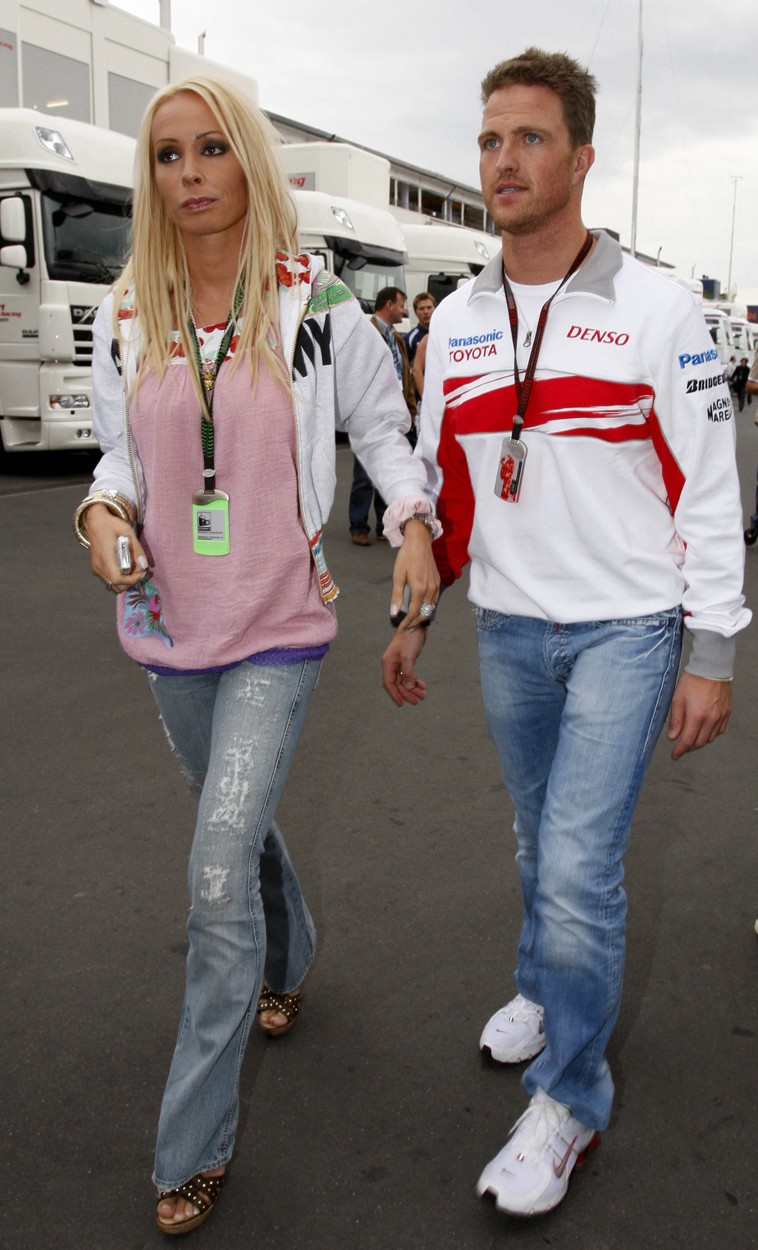 German Toyota driver Ralf Schumacher and his wife Cora walk in the pits of Nuerburgring racetrack, 21 July 2007 in Nuerburgring, after the qualifying session of the European Formula One Grand Prix. AFP PHOTO BERTRAND GUAY,Image: 21943728, License: Rights-managed, Restrictions: DV, Model Release: no