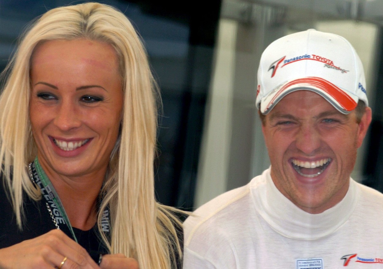 German Formula One driver Ralf Schumacher (R) of Toyota and his wife Cora Schumacher (L) seen at paddock of German Formula One Grand Prix at Hockenheim track in Germany on Saturday, 23 July 2005. German Formula One Grand Prix will take place on on Sunday. Ralf Schumacher took the 12th start position after qualifying session.  ARNE DEDERT,Image: 675449439, License: Rights-managed, Restrictions: , Model Release: no