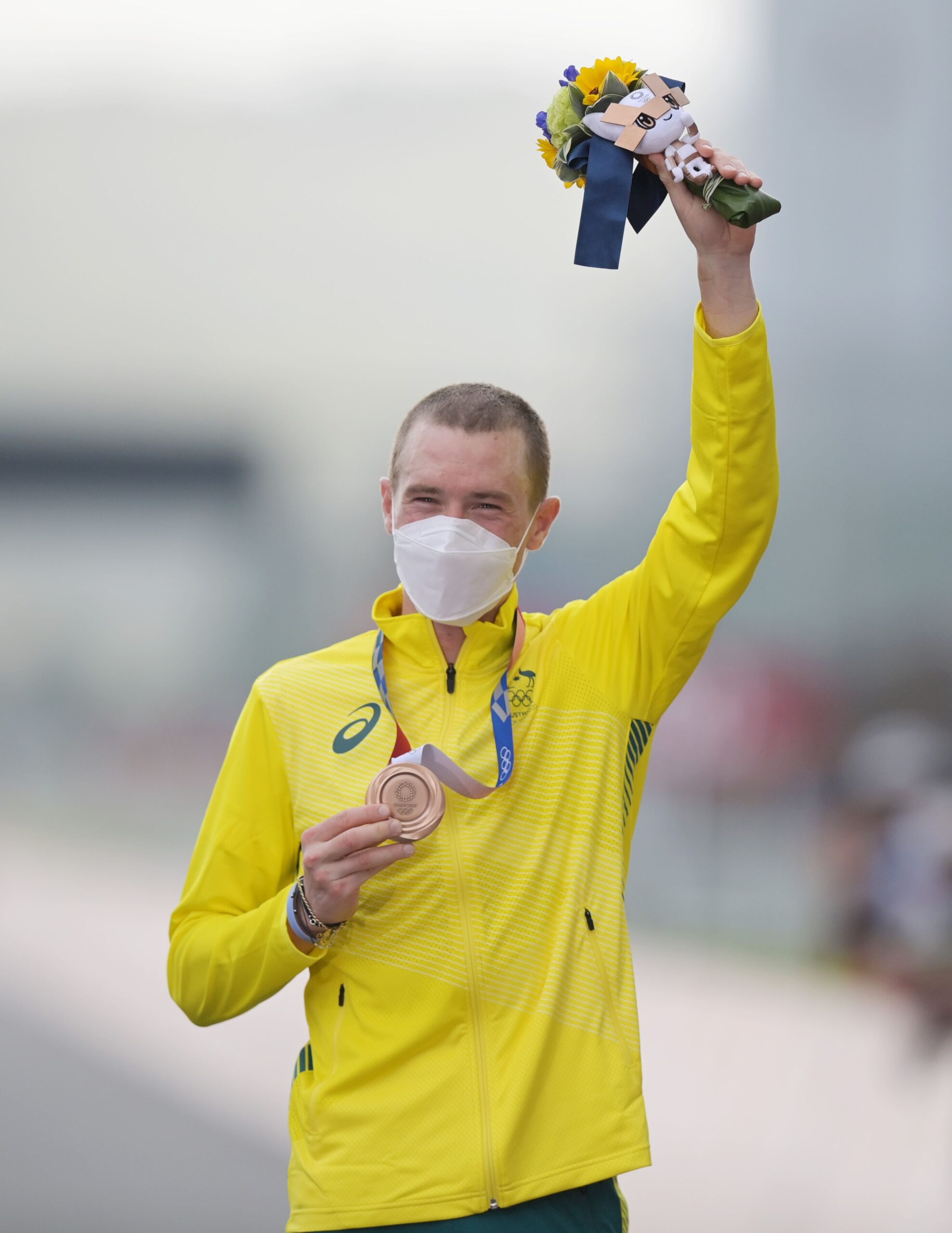 28 July 2021, Japan, Oyama: Australia's bronze medallist Rohan Dennis celebrates during the medal ceremony of the men's Cycling Individual Time Trial, 44.20km at Fuji International Speedway, during the Tokyo 2020 Olympic Games. Photo: Sebastian Gollnow/dpa