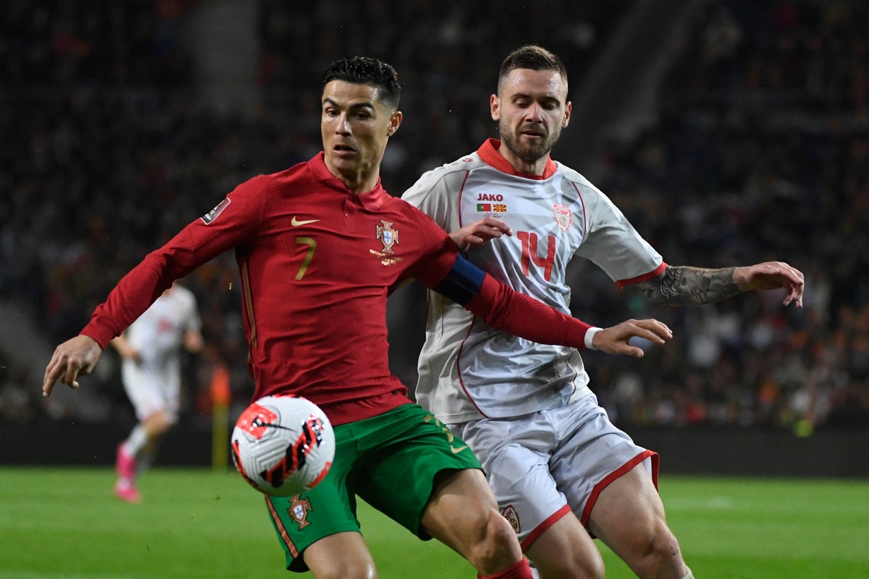 Portugal's forward Cristiano Ronaldo (L) vies with North Macedonia's defender Darko Velkovski during the World Cup 2022 qualifying final first leg football match between Portugal and North Macedonia at the Dragao stadium in Porto on March 29, 2022.,Image: 673859207, License: Rights-managed, Restrictions: , Model Release: no