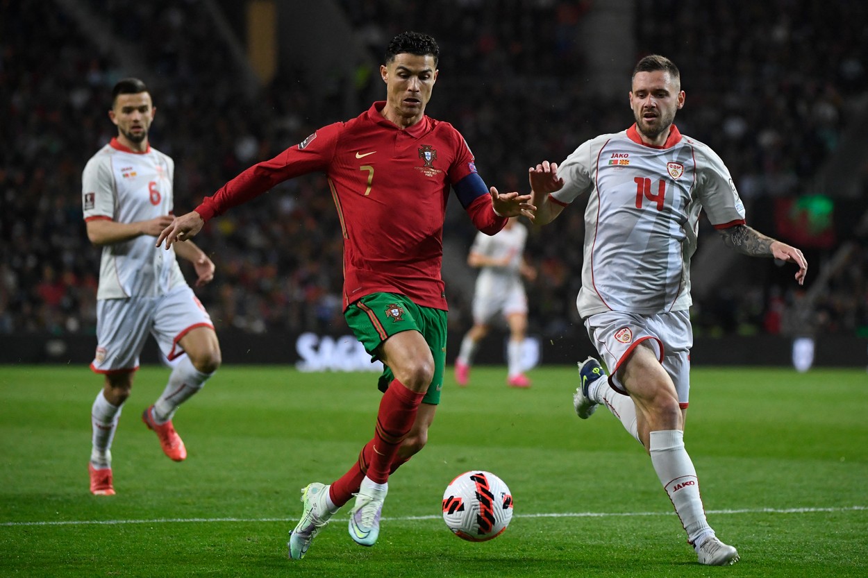 Portugal's forward Cristiano Ronaldo (L) fights for the ball with North Macedonia's defender Darko Velkovski during the World Cup 2022 qualifying final first leg football match between Portugal and North Macedonia at the Dragao stadium in Porto on March 29, 2022.,Image: 673870312, License: Rights-managed, Restrictions: , Model Release: no