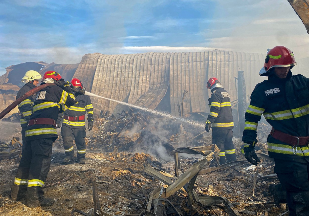 This handout photo taken and made available by the Inspectorate of Emergency Situations Prahova (ISU Prahova) on December 26, 2023 shows firefighters working to extinguish a fire at the site of teh 'Ferma Dacilor' guest house in Tohani, Romania.  At least one child and two adults were found charred by firefighters and ambulance crews who intervened in the morning of December 26 at the fire that broke out at the 'Ferma Dacilor' boarding house, according to the ISU Prahova. The flames that engulfed the guest house in Tohani, in Prahova county, spread over an area of approximately one thousand square meters. ISU has activated the red emergency plan and is responding with at least 50 firefighters.,Image: 832319450, License: Rights-managed, Restrictions: RESTRICTED TO EDITORIAL USE - MANDATORY CREDIT 