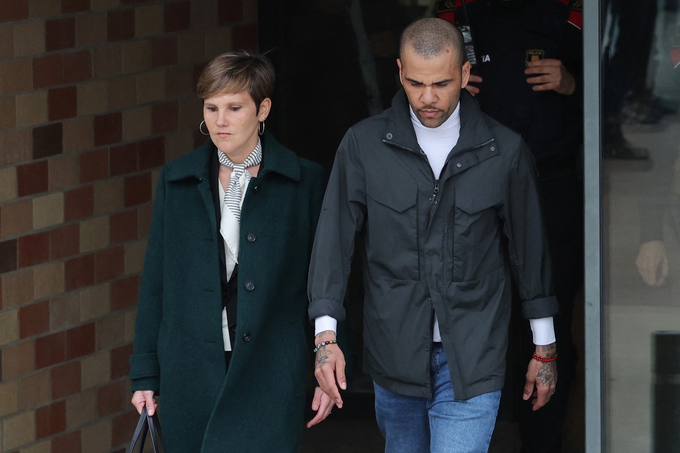 Convicted rapist and former Brazil international football player Dani Alves (R) leaves on provisional release, flanked by his lawyers Ines Guardiola at Brians 2 prison in Barcelona on March 25, 2024. Convicted rapist and former Brazil international Dani Alves left a jail in Barcelona on March 25, 2024 after posting the one-million-euro bail set by a Barcelona court to ensure his release pending appeal. Ex-Brazil star has been sentenced to 4.5 years in jail for rape on February 22, 2024.,Image: 859473923, License: Rights-managed, Restrictions: , Model Release: no