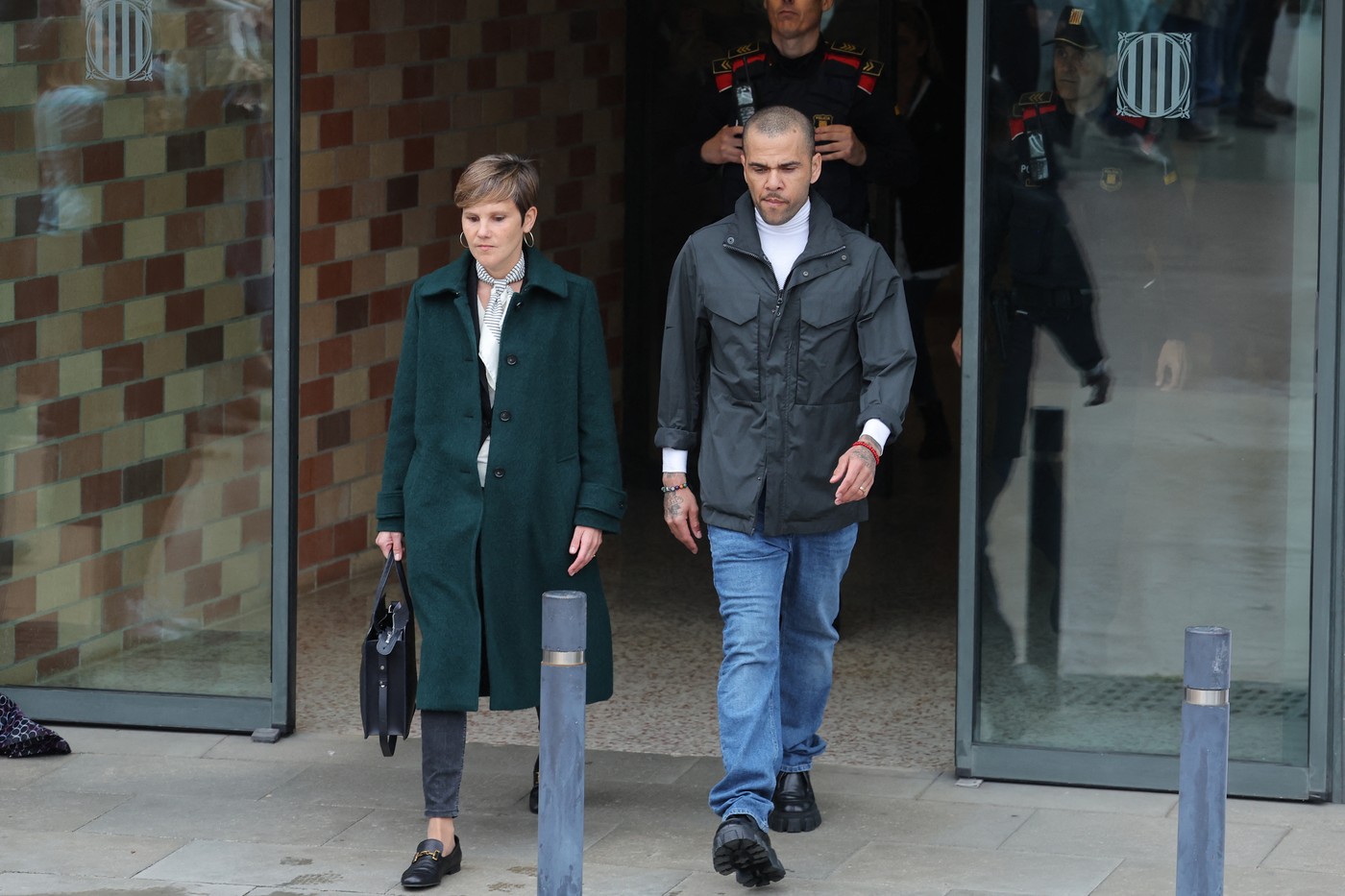 Convicted rapist and former Brazil international football player Dani Alves (R) leaves on provisional release, flanked by his lawyers Ines Guardiola at Brians 2 prison in Barcelona on March 25, 2024. Convicted rapist and former Brazil international Dani Alves left a jail in Barcelona on March 25, 2024 after posting the one-million-euro bail set by a Barcelona court to ensure his release pending appeal. Ex-Brazil star has been sentenced to 4.5 years in jail for rape on February 22, 2024.,Image: 859474235, License: Rights-managed, Restrictions: , Model Release: no