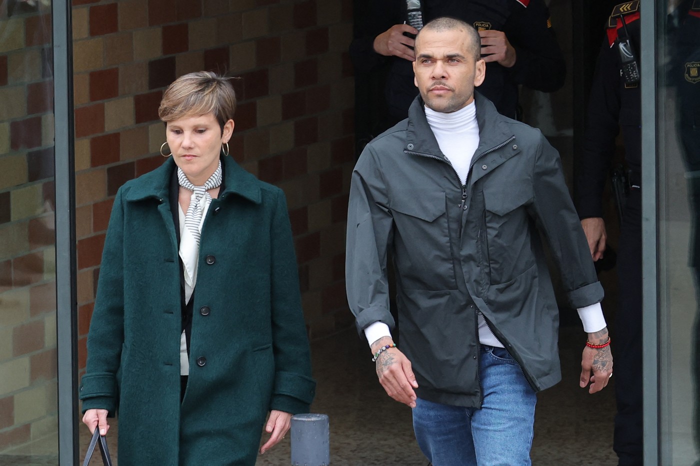 Convicted rapist and former Brazil international football player Dani Alves (R) leaves on provisional release, flanked by his lawyers Ines Guardiola, at Brians 2 prison in Barcelona on March 25, 2024. Convicted rapist and former Brazil international Dani Alves left a jail in Barcelona on March 25, 2024 after posting the one-million-euro bail set by a Barcelona court to ensure his release pending appeal. Ex-Brazil star has been sentenced to 4.5 years in jail for rape on February 22, 2024.,Image: 859474354, License: Rights-managed, Restrictions: , Model Release: no