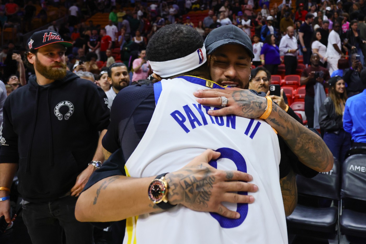 Mar 26, 2024; Miami, Florida, USA; Golden State Warriors guard Gary Payton II (0) hugs Brazilian soccer player Neymar Jr. after the game against the Miami Heat at Kaseya Center.,Image: 859907290, License: Rights-managed, Restrictions: , Model Release: no