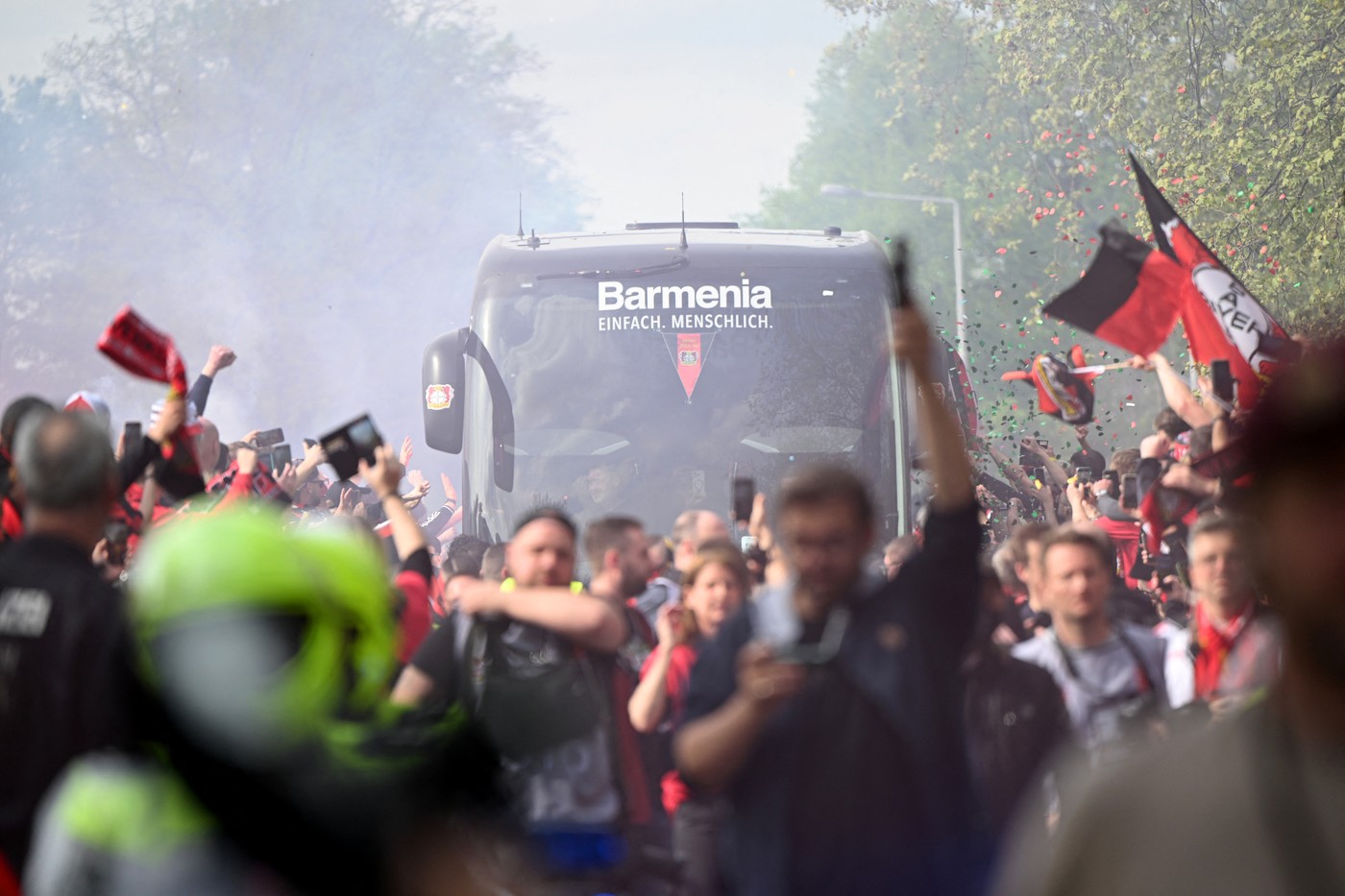 14 April 2024, North Rhine-Westphalia, Leverkusen: Soccer, Bundesliga, Bayer 04 Leverkusen - SV Werder Bremen, Matchday 29, BayArena. Leverkusen fans welcome the team bus and create a great atmosphere before the game. Photo: Federico Gambarini/dpa,Image: 864749424, License: Rights-managed, Restrictions: GERMANY OUT, Model Release: no