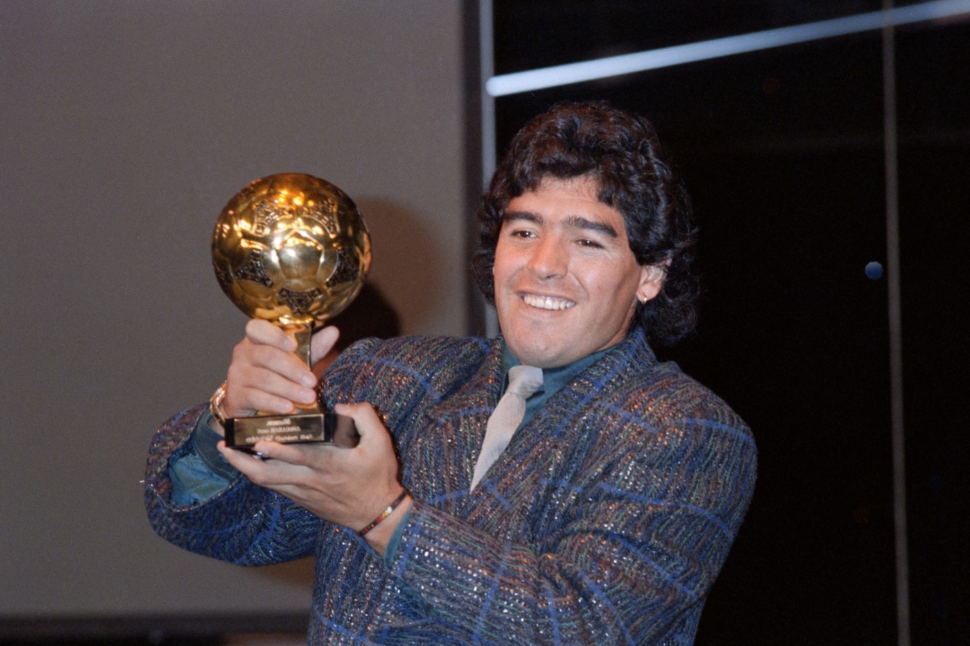 Diego Maradona poses with the Ballon d'Or at the Lido in Paris on November 13, 1986. He was awarded following the 1986 FIFA World Cup. The Golden Ball award is presented to the best player at each FIFA World Cup finals.,Image: 800969633, License: Rights-managed, Restrictions: , Model Release: no