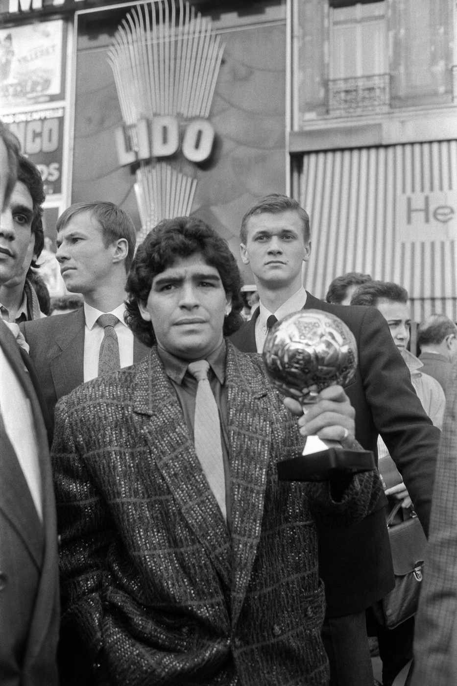 Diego Maradona poses with the Ballon d'Or in front of the Lido in Paris on November 13, 1986. He was awarded following the 1986 FIFA World Cup The Golden Ball award is presented to the best player at each FIFA World Cup finals.,Image: 800969848, License: Rights-managed, Restrictions: , Model Release: no
